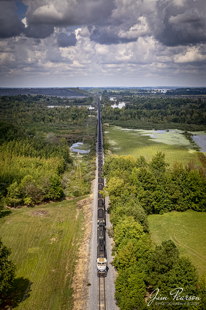 Paducah and Louisville Railway University of Kentucky Locomotive 4522 and PAL 4504 lead a northbound loaded Louisville Gas and Electric Coal train through a wetlands area as they depart on the Warrior Coal Mine lead, just west of Madisonville, Kentucky, on their way north to Louisville under partly cloudy summer skies.

Tech Info: DJI Mavic Air 2S Drone, RAW, 22mm, f/2.8, 1/2000, ISO 110, September 13, 2021.

#trainphotography #railroadphotography #trains #railways #dronephotography #trainphotographer #railroadphotographer #jimpearsonphotography