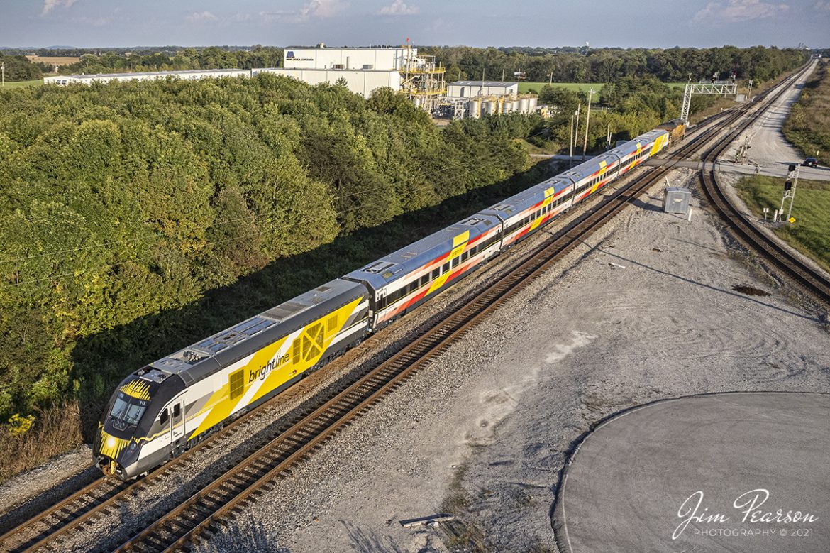 Union Pacific 2603 leads a brand new Brightline Commuter Trainset as it heads south as CSX W989 on the Henderson Subdivision at John Rivers Road Crossing at CSX Casky yard in Hopkinsville, Kentucky as it heads south to Florida on October 8th, 2021.

According to Wikipedia: "Brightline is a privately run inter-city rail route between Miami and West Palm Beach, Florida. Brightline began operating over its current route in January 2018 and the company is currently building an extension to the Orlando International Airport which is expected to enter service in 2022.

As of August 2020, it is the only privately owned and operated intercity passenger railroad in the United States. The line was developed starting in March 2012 as All Aboard Florida by Florida East Coast Industries, a Florida real estate developer owned by Fortress Investment Group. Construction began in November 2014 on stations and improvements to tracks owned by the Florida East Coast Railway, which at the start of construction, was also owned by Fortress (it was sold in January 2018)."

Tech Info: DJI Mavic Air 2S Drone, RAW, 22mm, f/2.8, 1/2000, ISO 100.

#trainphotography #railroadphotography #trains #railways #dronephotography #trainphotographer #railroadphotographer #jimpearsonphotography