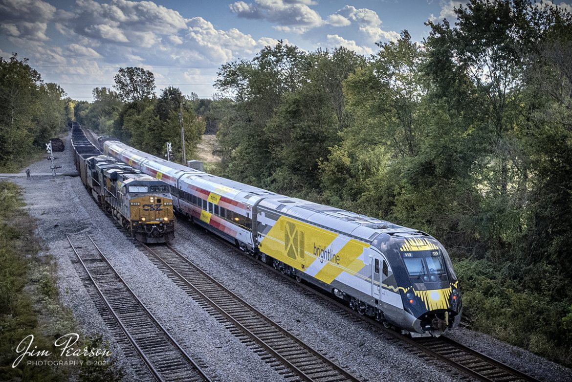 CSX W989 with Union Pacific 2603 leading a brand new Brightline Inter-City Trainset, passes a northbound empty coal train at Robards, Kentucky, as it heads south as on the Henderson Subdivision to Florida on October 8th, 2021.

According to Wikipedia: Brightline is a privately run inter-city rail route between Miami and West Palm Beach, Florida. Brightline began operating over its current route in January 2018 and the company is currently building an extension to the Orlando International Airport which is expected to enter service in 2022.

As of August 2020, it is the only privately owned and operated intercity passenger railroad in the United States. The line was developed starting in March 2012 as All Aboard Florida by Florida East Coast Industries, a Florida real estate developer owned by Fortress Investment Group. Construction began in November 2014 on stations and improvements to tracks owned by the Florida East Coast Railway, which at the start of construction, was also owned by Fortress (it was sold in January 2018).

Tech Info: DJI Mavic Air 2S Drone, RAW, 22mm, f/2.8, 1/1600, ISO 100.

#trainphotography #railroadphotography #trains #railways #dronephotography #trainphotographer #railroadphotographer #jimpearsonphotography