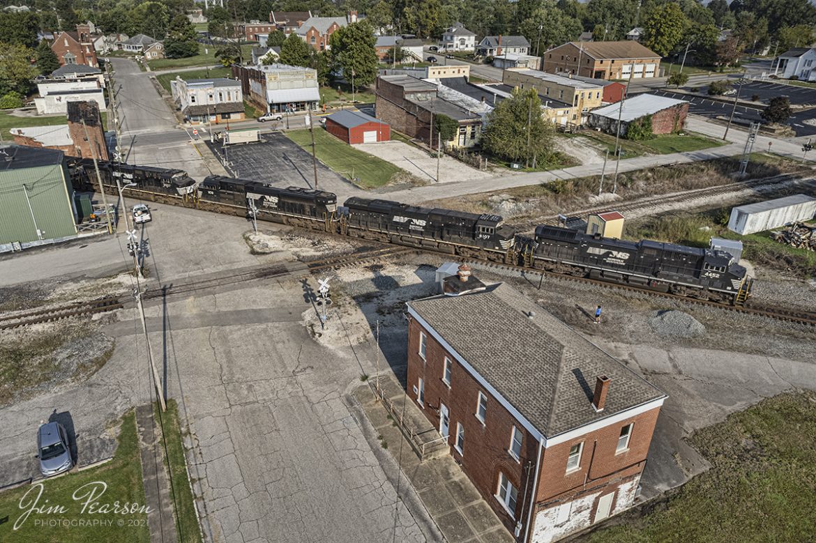Norfolk Southern 167 passes through downtown Oakland City, Indiana as it crosses over the Indiana Southern line at the diamond, on its way east along the NS Southern East District with five locomotives and NS 4452 leading the charge on October 9th, 2021!

Tech Info: DJI Mavic Air 2S Drone, RAW, 22mm, f/2.8, 1/2000, ISO 100.

#trainphotography #railroadphotography #trains #railways #dronephotography #trainphotographer #railroadphotographer #jimpearsonphotography