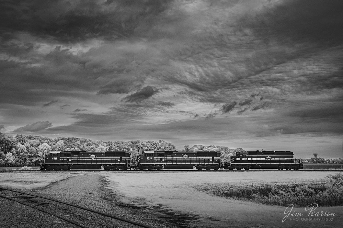In this infrared photo we find Evansville Western Railway 4517, 4519 and 6002 as they sit tied down at the entrance of the Mt. Vernon Transfer Terminal, while they wait for their next assignment at Mt. Vernon, Indiana. There wasnt a coal train in the transloading facility so the only thing I can figure is they were waiting to pick up cars at the Port of Indiana.

According the EVWR website: The Mt. Vernon Transfer Terminal is a coal-loading terminal on the Ohio River at Mt. Vernon, Indiana. Coal is delivered to Mt. Vernon by both rail and truck. The terminal has a capacity of 8 million tons per year with existing ground storage. Mt. Vernon is capable of receiving and unloading 105-car unit trains of coal via EVWR (with direct connections to the majority of Class I railroads) that can transfer to ground storage and/or direct to barge(s).

Tech Info: Fuji XT-1, RAW, Converted to 720nm B&W IR, Sigma 24-70 @ 24mm, f/5.6, 1/500, ISO 400, October 13th, 2021.

#trainphotography #railroadphotography #trains #railways #jimpearsonphotography #infraredtrainphotography #infraredphotography #trainphotographer #railroadphotographer
