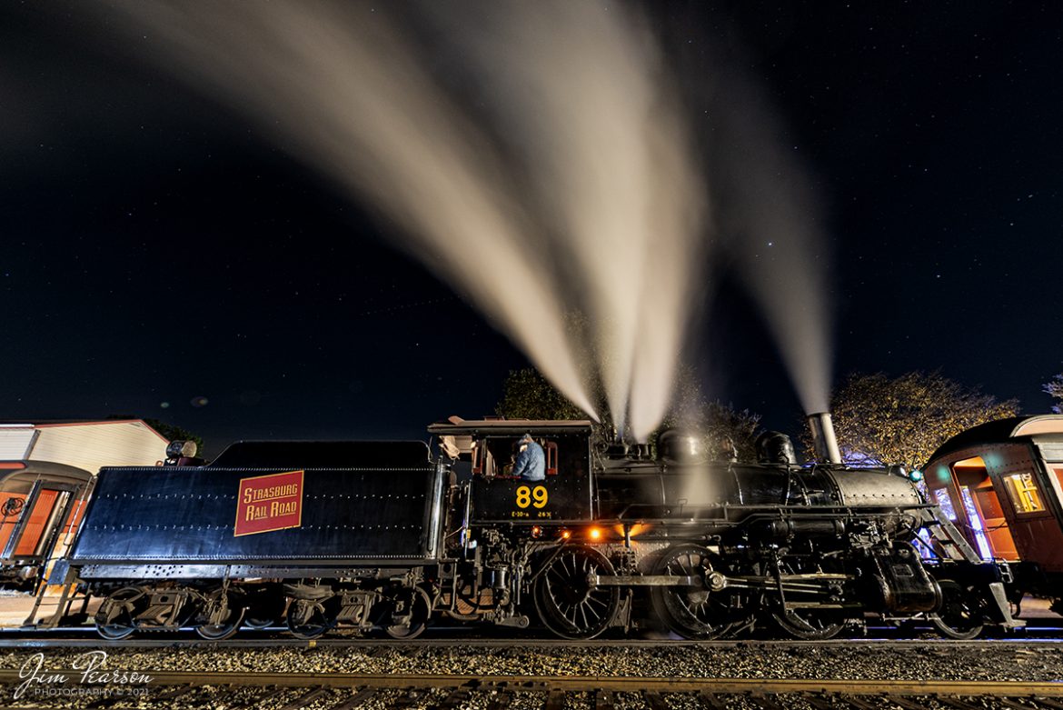 A crew member sits in the window on Strasburg Railroad steam locomotive #89, as they wait to depart with the last train of the day on the Strasburg Railroad on November 6th, 2021, at Strasburg, Pennsylvania. 

According to Wikipedia: Strasburg Railroad (Canadian National) No. 89 is a 2-6-0 "Mogul" type steam locomotive originally built by the Canadian Locomotive Company in February 1910 for the Canadian National Railway. It is now owned and operated by the Strasburg Railroad outside of Strasburg, Pennsylvania where it resides today for use on excursion trains.

Tech Info: Nikon D800, RAW, Irex 11mm, f/4, 20 seconds, ISO 200.

#trainphotography #railroadphotography #trains #railways #jimpearsonphotography #trainphotographer #railroadphotographer #trainsatnight #steamtrains