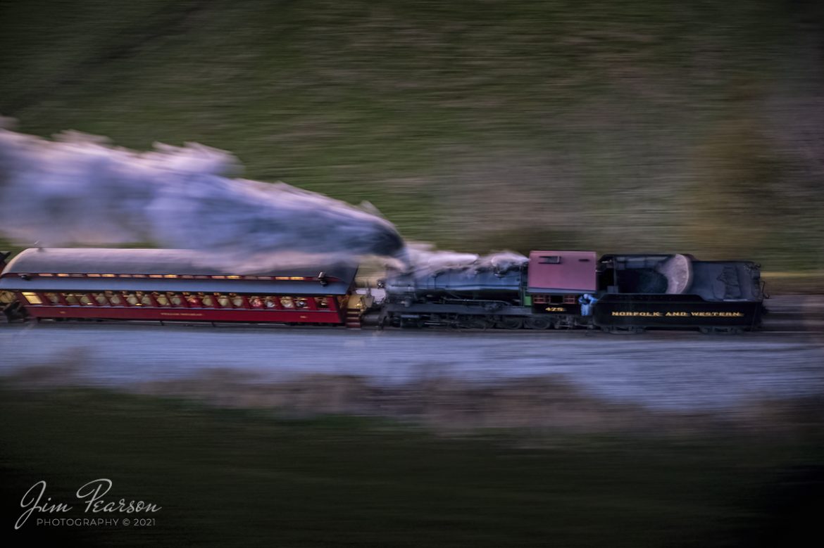 The Conductor on Norfolk and Western 475 watches the countryside roll-by as they depart with the last passenger train of the day, eastbound at dusk after, pulling in reverse out of the depot at the Strasburg Railroad the last light of the day barley illuminates the train and steam. The cold November air produces a spectacular show of steam trailing along the train on September 9th, 2021 at Strasburg, Pennsylvania. Once they reach their turn around point down the line they will reverse the locomotive by running around the train and head back to the station.

According to Wikipedia: Strasburg Railroad (Norfolk and Western) No. 475 is a 4-8-0 "Mastodon" type steam locomotive owned and operated by the Strasburg Railroad outside of Strasburg, Pennsylvania. Built by the Baldwin Locomotive Works in June 1906, it was part of the Norfolk and Western's first order of M class numbered 375-499. Today, No. 475 is the only operating 4-8-0 type in North America and the Strasburg Rail Road's oldest operating steam locomotive.

Tech Info: DJI Mavic Air 2S Drone, RAW, 22mm, f/2.8, 2.5 sec, ISO 400.

#trainphotography #railroadphotography #trains #railways #dronephotography #trainphotographer #railroadphotographer #jimpearsonphotography