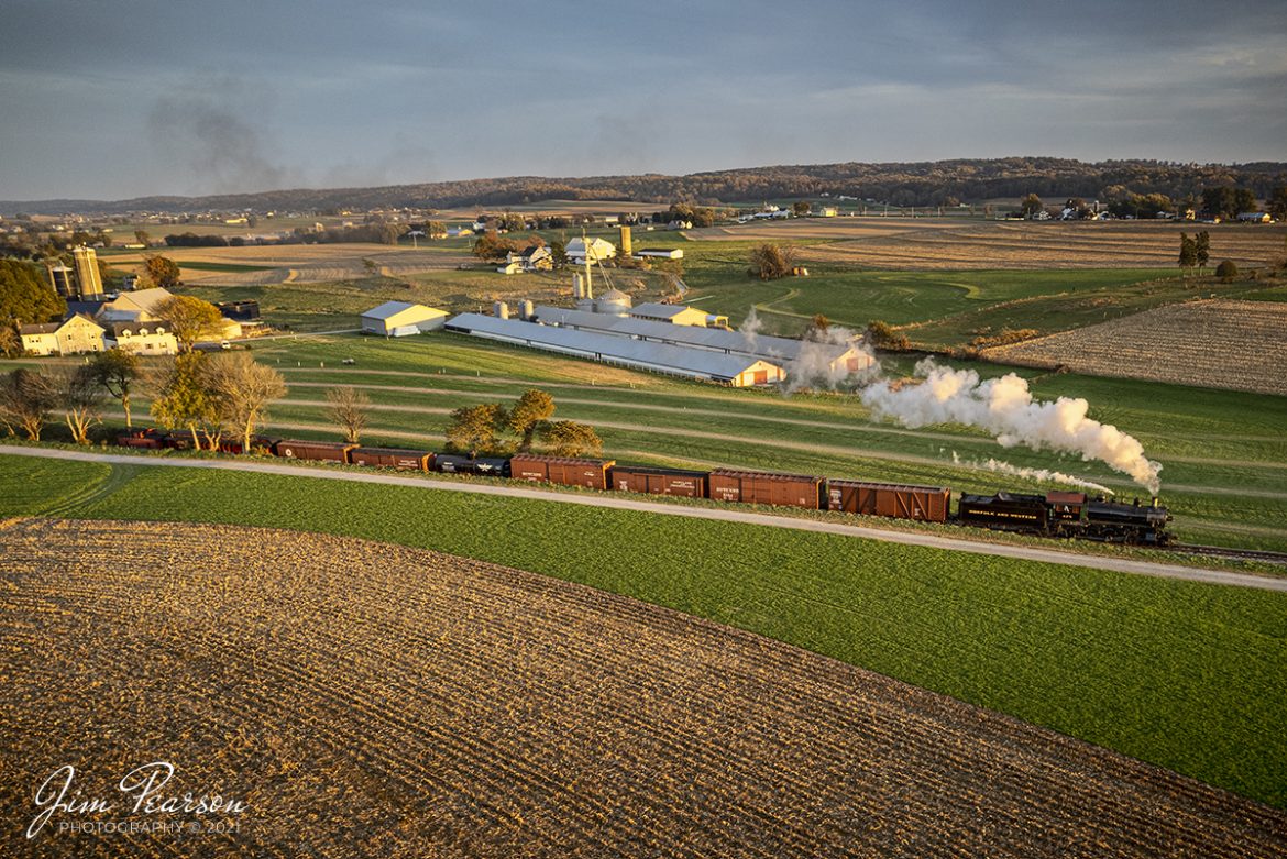 Norfolk and Western 4-8-0 steam locomotive 475 pulls a freight train as it makes its way west through the Amish countryside into the setting sun, on the Strasburg Railroad at Strasburg, Pennsylvania on November 7th, 2021. 

According to Wikipedia: Strasburg Railroad (Norfolk and Western) No. 475 is a 4-8-0 "Mastodon" type steam locomotive owned and operated by the Strasburg Railroad outside of Strasburg, Pennsylvania. Built by the Baldwin Locomotive Works in June 1906, it was part of the Norfolk and Western's first order of M class numbered 375-499. Today, No. 475 is the only operating 4-8-0 type in North America and the Strasburg Rail Road's oldest operating steam locomotive.

Tech Info: DJI Mavic Air 2S Drone, RAW, 22mm, f/2.8, 1/180, ISO 120.

#trainphotography #railroadphotography #trains #railways #dronephotography #trainphotographer #railroadphotographer #jimpearsonphotography #steamtrain #steamlocomotive #strasburgrailroad
