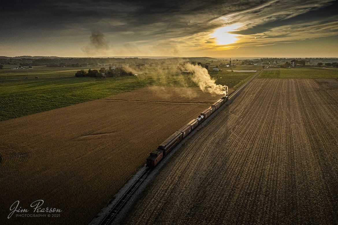 Strasburg Railroad caboose #12 brings up the rear of a mixed freight as steam locomotive Norfolk & Western 475 leads their train west into the setting sun at Strasburg, Pennsylvania on November 7th, 2021.

According to Wikipedia: Strasburg Railroad (Norfolk and Western) No. 475 is a 4-8-0 "Mastodon" type steam locomotive owned and operated by the Strasburg Railroad outside of Strasburg, Pennsylvania. Built by the Baldwin Locomotive Works in June 1906, it was part of the Norfolk and Western's first order of M class numbered 375-499. Today, No. 475 is the only operating 4-8-0 type in North America and the Strasburg Rail Road's oldest operating steam locomotive.

Tech Info: DJI Mavic Air 2S Drone, RAW, 22mm, f/2.8, 1/8000, ISO 400.

#trainphotography #railroadphotography #trains #railways #dronephotography #trainphotographer #railroadphotographer #jimpearsonphotography #steamtrain