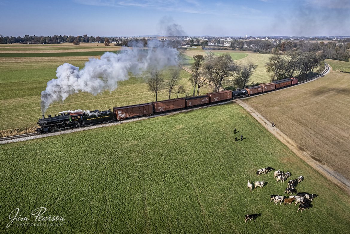 Norfolk and Western 475 passes a group of Amish boys and cows, as they make their way west though a farm crossing, at the location known as Carpenters/Beilers, on the Strasburg Railroad at Paradise, Pennsylvania on November 7th, 2021. 

According to Wikipedia: Strasburg Railroad (Norfolk and Western) No. 475 is a 4-8-0 "Mastodon" type steam locomotive owned and operated by the Strasburg Railroad outside of Strasburg, Pennsylvania. Built by the Baldwin Locomotive Works in June 1906, it was part of the Norfolk and Western's first order of M class numbered 375-499. Today, No. 475 is the only operating 4-8-0 type in North America and the Strasburg Rail Road's oldest operating steam locomotive.

Tech Info: DJI Mavic Air 2S Drone, RAW, 22mm, f/2.8, 1/6000, ISO 400.

#trainphotography #railroadphotography #trains #railways #dronephotography #trainphotographer #railroadphotographer #jimpearsonphotography