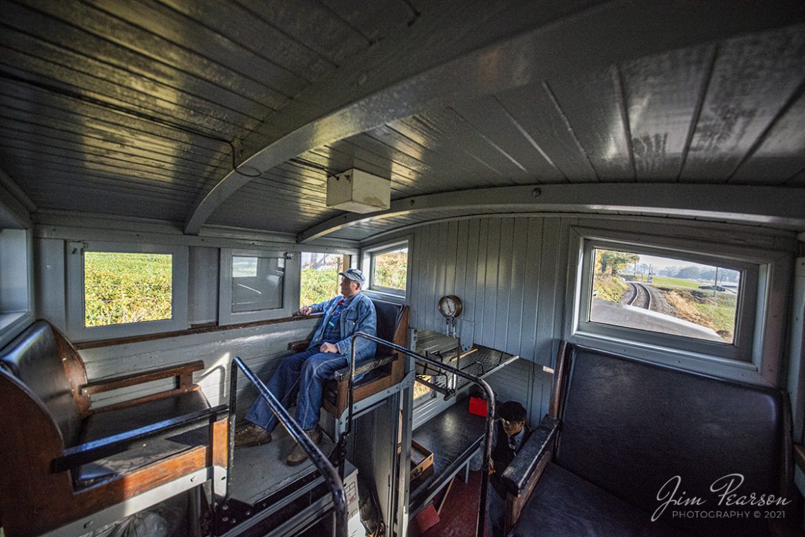 Conductor Christopher Pollock keeps a watchful eye from the caboose as Norfolk and Western 475 heads west on the Strasburg Railroad on November 7th, 2021 at Strasburg, Pennsylvania. 

Tech Info: Nikon D800, RAW, Irex 11mm, f/4, 1/1000, ISO 2800.

#trainphotography #railroadphotography #trains #railways #jimpearsonphotography #trainphotographer #railroadphotographer