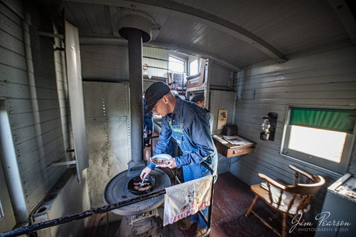 Matthew Bryant prepares breakfast for the crew of caboose #12 during a Historic Transport Preservation, Inc, Steam Special from Strasburg on November 7th, 2021 being pulled by Norfolk Western steam locomotive 475. The caboose was built in 1925 by the Standard Steel Car Company and was used as Detroit, Toledo, and Ironton RR #95. It arrived at the Strasburg Railroad in 1964.
According to Wikipedia: Strasburg Railroad (Norfolk and Western) No. 475 is a 4-8-0 "Mastodon" type steam locomotive owned and operated by the Strasburg Railroad outside of Strasburg, Pennsylvania. Built by the Baldwin Locomotive Works in June 1906, it was part of the Norfolk and Western's first order of M class numbered 375-499. Today, No. 475 is the only operating 4-8-0 type in North America and the Strasburg Rail Road's oldest operating steam locomotive.
Tech Info: Nikon D800, RAW, Irex 11mm, f/4, 1/100, ISO 2000.