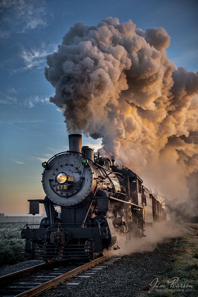 Norfolk and Western 475 heads west on the Strasburg Railroad at sunrise as the cold November air produces a spectacular show of steam trailing, as the train approaches the Esbenshade Road Crossing on November 7th, 2021, at Strasburg, Pennsylvania.

According to Wikipedia: Strasburg Railroad (Norfolk and Western) No. 475 is a 4-8-0 "Mastodon" type steam locomotive owned and operated by the Strasburg Railroad outside of Strasburg, Pennsylvania. Built by the Baldwin Locomotive Works in June 1906, it was part of the Norfolk and Western's first order of M class numbered 375-499. Today, No. 475 is the only operating 4-8-0 type in North America and the Strasburg Rail Road's oldest operating steam locomotive.

Tech Info: Nikon D800, RAW, Sigma 24-70 @ 36mm, f/2.8, 1/400, ISO 360.

#trainphotography #railroadphotography #trains #railways #jimpearsonphotography #trainphotographer #railroadphotographer