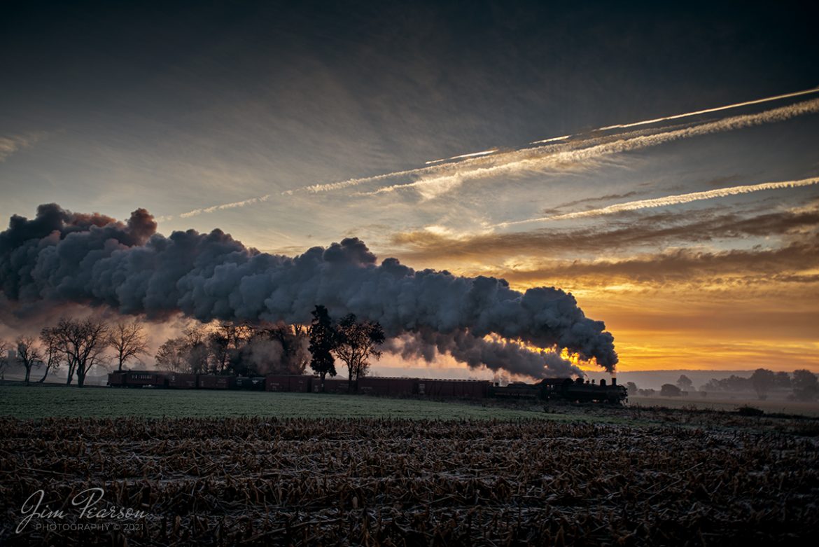 Norfolk & Western Steam Locomotive 475 heads west on the Strasburg Railroad the rising sun illuminates the sky behind the train and steam as the cold November air produces a spectacular show of steam trailing over the train, as the train approaches the Esbenshade Road Crossing on September 7th, 2021 at Strasburg, Pennsylvania. 

According to Wikipedia: Strasburg Railroad (Norfolk and Western) No. 475 is a 4-8-0 "Mastodon" type steam locomotive owned and operated by the Strasburg Railroad outside of Strasburg, Pennsylvania. Built by the Baldwin Locomotive Works in June 1906, it was part of the Norfolk and Western's first order of M class numbered 375-499. Today, No. 475 is the only operating 4-8-0 type in North America and the Strasburg Rail Road's oldest operating steam locomotive.

Tech Info: Nikon D800, RAW, Sigma 24-70 @ 24mm, f/2.8, 1/400, ISO 100.

#trainphotography #railroadphotography #trains #railways #jimpearsonphotography #trainphotographer #railroadphotographer