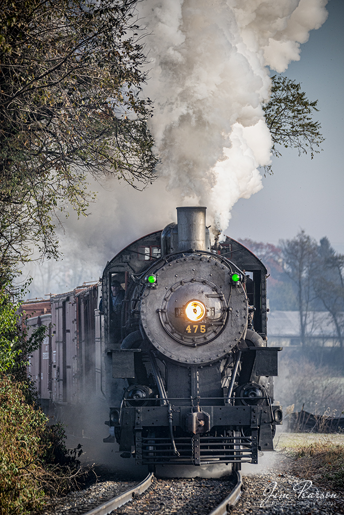 Engineer Dan Potts keeps an eye on the road ahead as he controls Norfolk and Western 475, as he pulls west through the long curve coming out of Leaman Place Junction at Paradise, PA, on the Strasburg Railroad toward headed toward Strasburg, PA, on November 7th, 2021. 

According to Wikipedia: Strasburg Railroad (Norfolk and Western) No. 475 is a 4-8-0 "Mastodon" type steam locomotive owned and operated by the Strasburg Railroad outside of Strasburg, Pennsylvania. Built by the Baldwin Locomotive Works in June 1906, it was part of the Norfolk and Western's first order of M class numbered 375-499. Today, No. 475 is the only operating 4-8-0 type in North America and the Strasburg Rail Road's oldest operating steam locomotive.

Tech Info: Nikon D800, RAW, Sigma 150-600 @ 290mm, f/5.6, 1/250, ISO 800.

#trainphotography #railroadphotography #trains #railways #jimpearsonphotography #trainphotographer #railroadphotographer