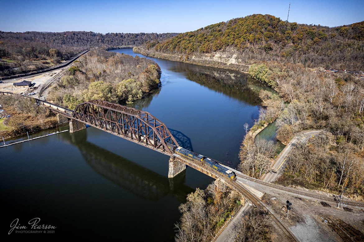 The conductor on a CSX loaded coal train stands on the nose of CSXT 3176 as his train crosses the Monongahela River at Brownsville, Pennsylvania. They are headed off the NS Mon Line where the conductor will throw the switch onto the NS Loveridge Secondary for their continued movement southbound. 

Tech Info: DJI Mavic Air 2S Drone, RAW, 22mm, f/2.8, 1/2000, ISO 120.

#trainphotography #railroadphotography #trains #railways #dronephotography #trainphotographer #railroadphotographer #jimpearsonphotography