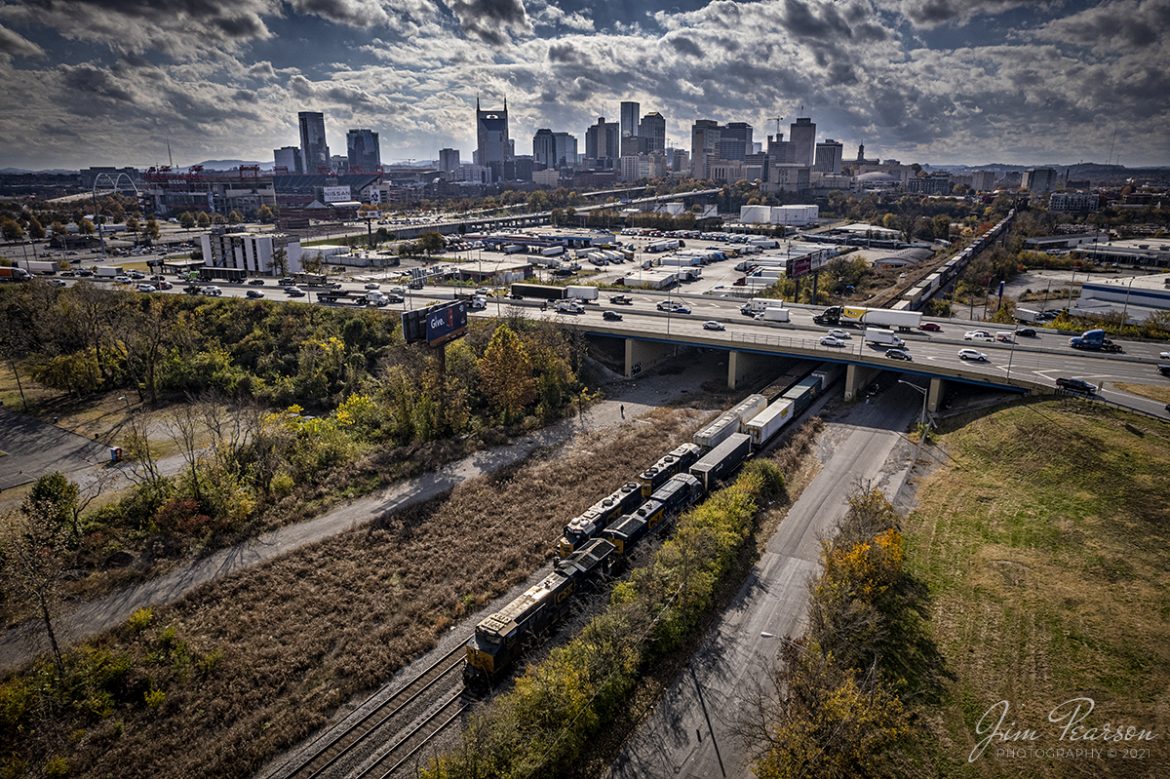 CSXT 3406 leads CSX Q026 as it passes under I-24 and a local job waiting in the siding for him to clear, as Q026 departs downtown Nashville, Tennessee on the Terminal Subdivision heading north on November 17th, 2021, headed to Bedford Park, IL.

Tech Info: DJI Mavic Air 2S Drone, RAW, 22mm, f/2.8, 1/4000, ISO 100.

#trainphotography #railroadphotography #trains #railways #dronephotography #trainphotographer #railroadphotographer #jimpearsonphotography