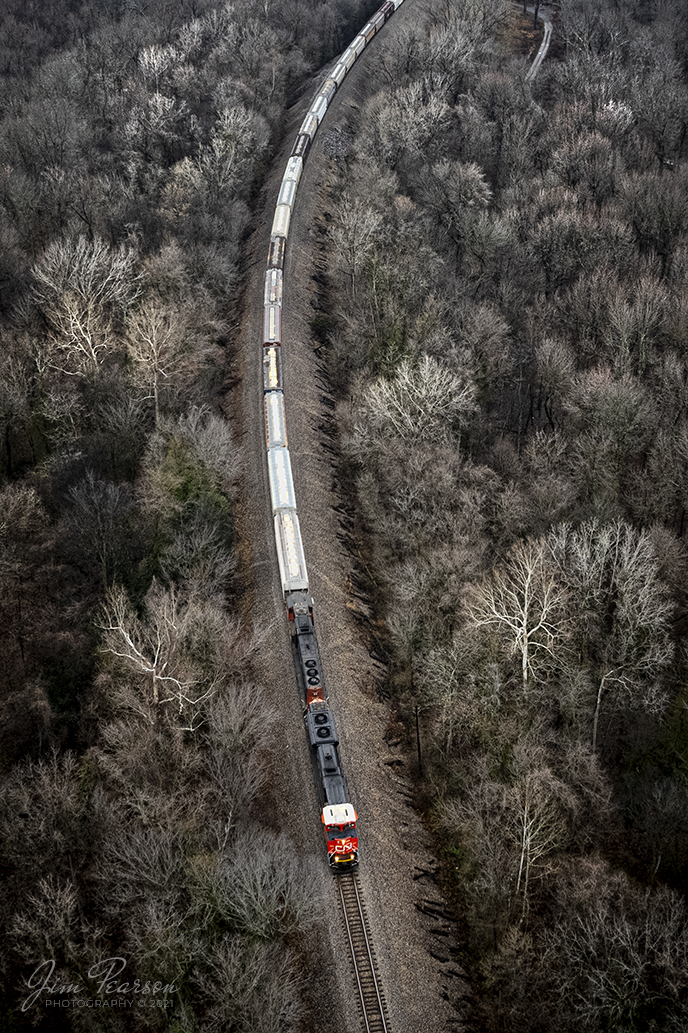 Canadian National 8892 and 5725 lead a grain train southbound on the CN Buford Subdivision, through the bare forest, after coming across the Metropolis, Illinois Bridge over the Ohio River on December 29th, 2021 at West Paducah, Kentucky.

Tech Info: DJI Mavic Air 2S Drone, RAW, 22mm, f/2.8, 1/160, ISO 140.

#trainphotography #railroadphotography #trains #railways #jimpearsonphotography #trainphotographer #railroadphotographer
