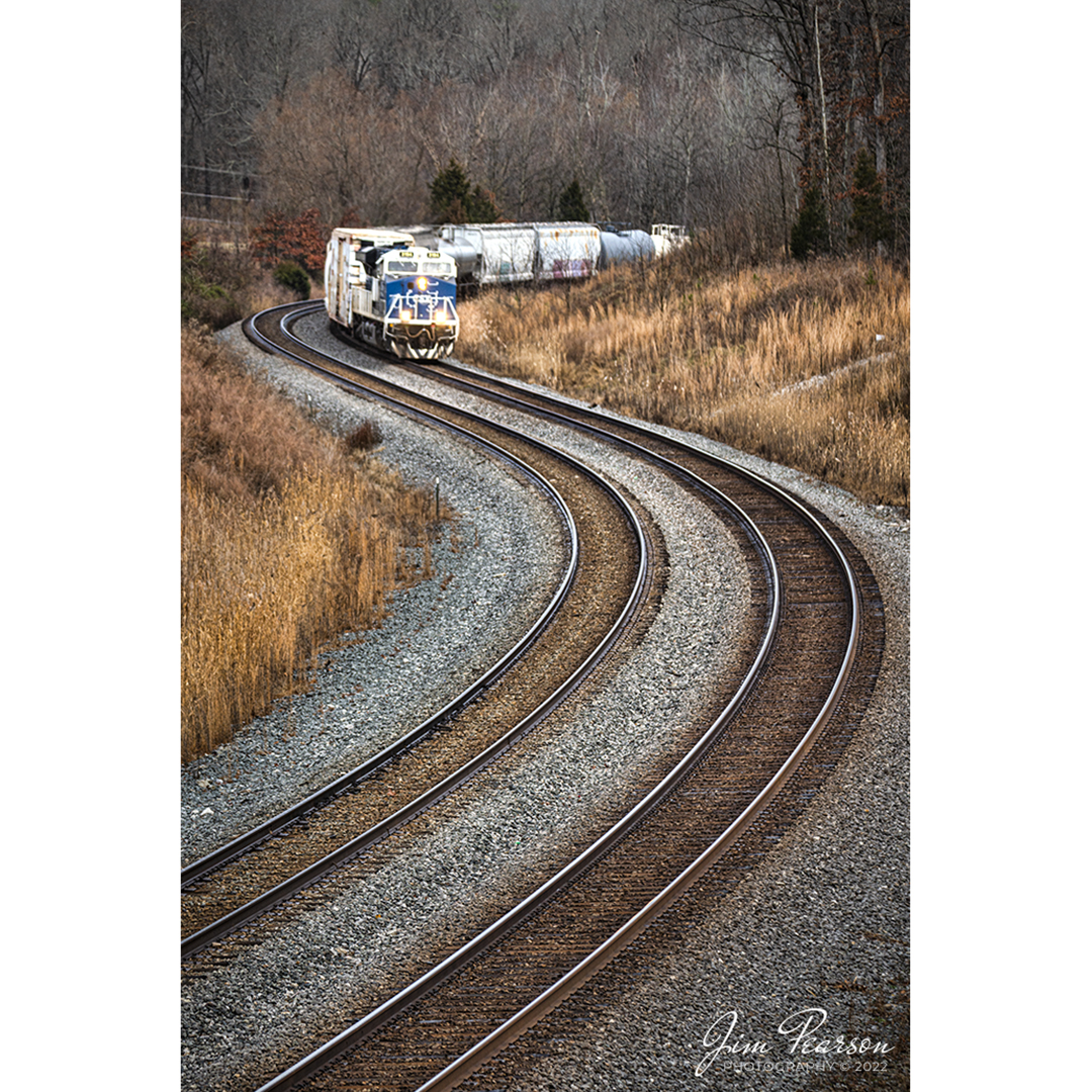 CSX Q513 heads through the S curve at Nortonville, Kentucky with CSXT 3194, the Spirit of Law Enforcement Unit leading, as it heads south on the Henderson Subdivision on New Year's Eve, December 31st, 2021. 

From an August 2019 CSXT Press Release: CSXT 3194 is being renamed to honor our nation's police officers who dedicate their lives to serve and protect communities across our network.

"CSX is proud of the employee craftsmanship involved in transforming this locomotive into a special commemorative engine," says Ed Harris, executive vice president of operations. "This is a moving tribute to the men and women who serve us every day and aligns with CSX's goal to connect military service members, first responders, and their families to the resources and support they need."

The Spirit of our Law Enforcement joins our collection of Pride in Service locomotives launched this spring - the Spirit of our Armed Forces and the Spirit of our First Responders. When not actively moving customers'freight, the locomotives are made available for special events along the CSX system - extending our culture of service and commitment from our customers to the communities where we operate.

Tech Info: Nikon D800, RAW, Sigma 150-600 @ 160mm, f/5.3, 1/1000, ISO 160.

#trainphotography #railroadphotography #trains #railways #jimpearsonphotography #trainphotographer #railroadphotographer