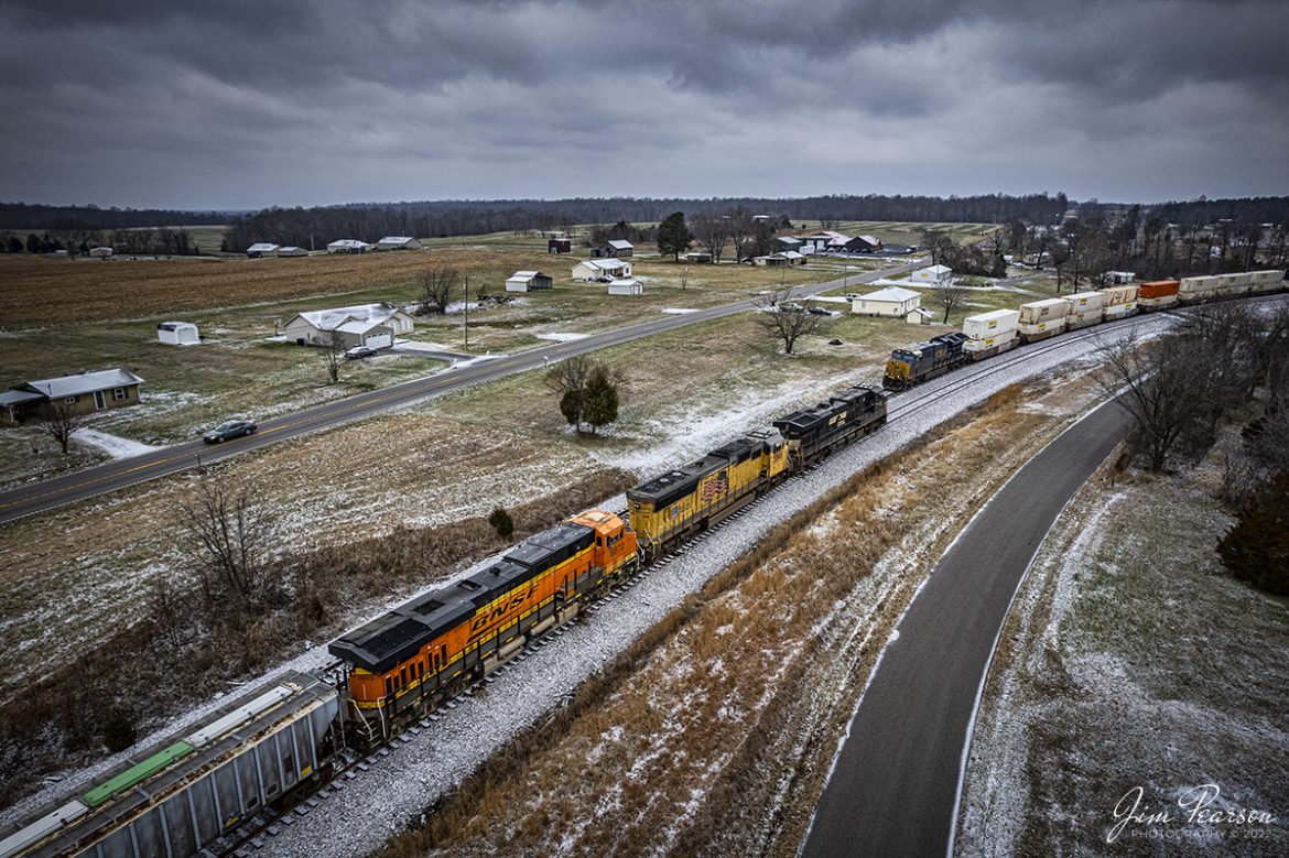 Four of the major railroads are represented here in this shot of northbound empty ethanol train, CSX K442 (Hookers Point - Tampa, FL to Bensenville, IL), being led by Norfolk Southern 7607, Union Pacific 3898 and BNSF 6872, waits in the siding at the north end of Kelly, Kentucky. 

Here they meet a southbound hot intermodal, I029, led by CSXT 3472, (59th Street Yard - Chicago, IL to Fairburn, GA) on January 17th, 2022, on the Henderson Subdivision.


Tech Info: DJI Mavic Air 2S Drone, RAW, 22mm, f/2.8, 1/500, ISO 150.


#trainphotography #railroadphotography #trains #railways #jimpearsonphotography #trainphotographer #railroadphotographer