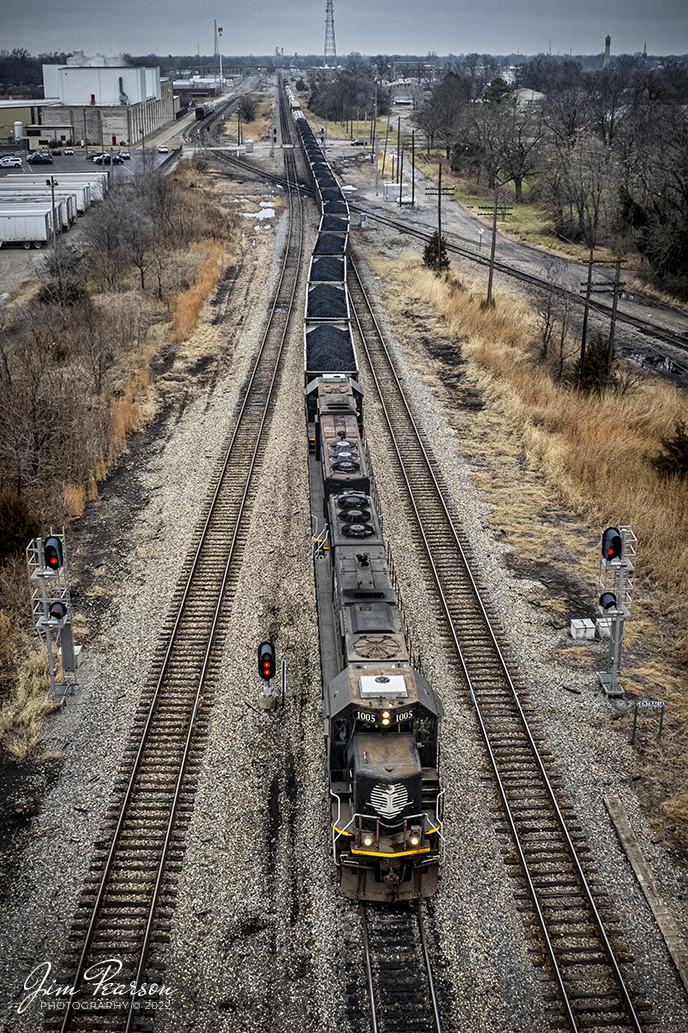 Canadian National A408 passes through the diamonds on CN Centralia Subdivision at Centralia, Illinois as it pulls south into the yard on December 29th, 2021, with Illinois Central units 1005 and 1022 leading the way.

The Centralia Subdivision formerly belonged to the Illinois Central Railroad and was constructed between 1854-1855. The double trackage was added between 1900-1902 and the line runs between Centralia and Cairo, Illinois. 

Tech Info: DJI Mavic Air 2S Drone, RAW, 22mm, f/2.8, 1/640, ISO 110.

#trainphotography #railroadphotography #trains #railways #dronephotography #trainphotographer #railroadphotographer #jimpearsonphotography