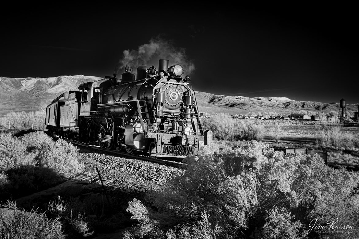 In this dramatic black and white Infrared photo Nevada Northern Railway engine 81 leads a passenger train as they head into Robinson Canyon at the Lackawanna Crossing on the Robinson Canyon Route on February 12th, 2022.

This was the train that carried the photographers this evening during a three-day Winter Photo Charter event that ran from February 11-13th, 2022. 

Nevada Northern No. 81 is a "Consolidation" type (2-8-0) steam locomotive that was built for the Nevada Northern in 1917 by the Baldwin Locomotive Works in Philadelphia, PA, at a cost of $23,700. It was built for Mixed service to haul both freight and passenger trains on the Nevada Northern railway.

According to Wikipedia: The Nevada Northern Railway Museum is a railroad museum and heritage railroad located in Ely, Nevada and operated by a historic foundation dedicated to the preservation of the Nevada Northern Railway.

Tech Info: Fuji XT-1, RAW, Converted to 720nm B&W IR, Nikon 10-24 @ 24mm, f/4.5, 1/460, ISO 200.

#trainphotography #railroadphotography #trains #railways #jimpearsonphotography #infraredtrainphotography #infraredphotography #trainphotographer #railroadphotographer #steamtrains #nevadanorthernrailway