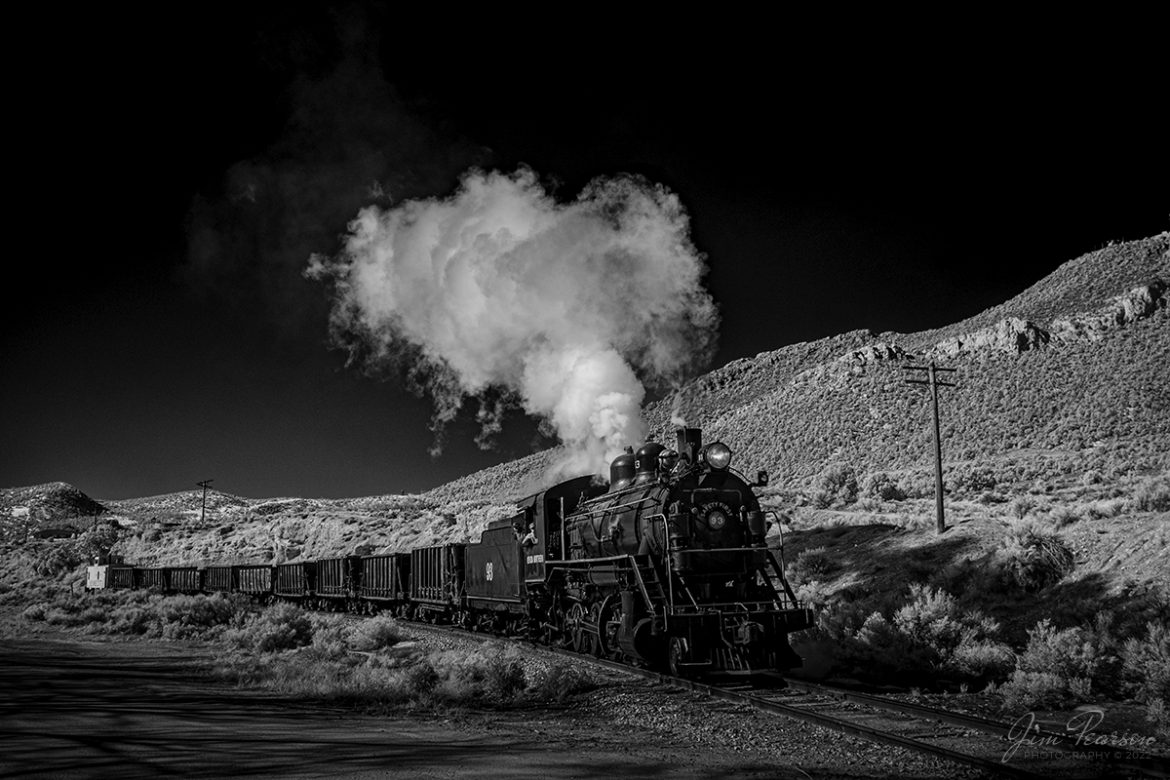 In this dramatic black and white Infrared photo Nevada Northern Railway engine 93 heads back to Ely, Nevada with an empty ore train under the control of engineer Jim Montague and fireman, as they approach the Lackawanna Crossing on the Robinson Canyon Route on February 12th, 2022.

They werent moving ore but was a part of the museums three-day Winter Photo Charter event that ran from February 11-13th, 2022. This was my first trip to the Nevada Northern and won't be my last!

Locomotive #93 is a 2-8-0 that was built by the American Locomotive Company in January of 1909 at a cost of $17,610. It was the last steam locomotive to retire from original revenue service on the Nevada Northern Railway in 1961 and was restored back into service in 1993, according to the NNRY website.

According to Wikipedia: The Nevada Northern Railway Museum is a railroad museum and heritage railroad located in Ely, Nevada and operated by a historic foundation dedicated to the preservation of the Nevada Northern Railway.

Tech Info: Fuji XT-1, RAW, Converted to 720nm B&W IR, Nikon 10-24 @ 24mm, f/4.5, 1/420, ISO 200.

#trainphotography #railroadphotography #trains #railways #jimpearsonphotography #infraredtrainphotography #infraredphotography #trainphotographer #railroadphotographer #steamtrains #nevadanorthernrailway