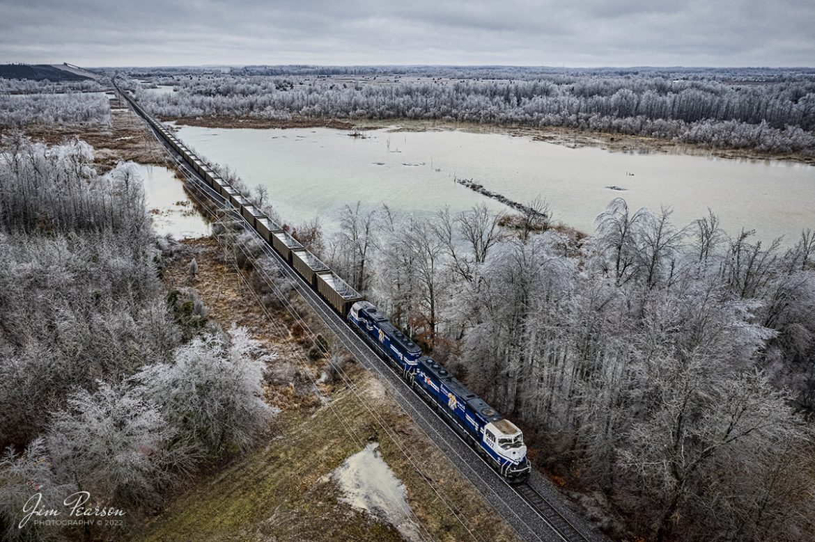 Paducah and Louisville Railway's University of Kentucky locomotives 4522 and 2012 bring up the rear of an empty Louisville Gas and Electric coal train, as it heads up the lead to the Warrior coal mine loop, outside of Madisonville, Ky on an icy December 3rd, 2022.

Tech Info: DJI Mavic Air 2 Drone, RAW, 4.5mm (24mm equivalent lens) f/2.8, 1/125, ISO 140.

#trainphotography #railroadphotography #trains #railways #jimpearsonphotography #trainphotographer #railroadphotographer