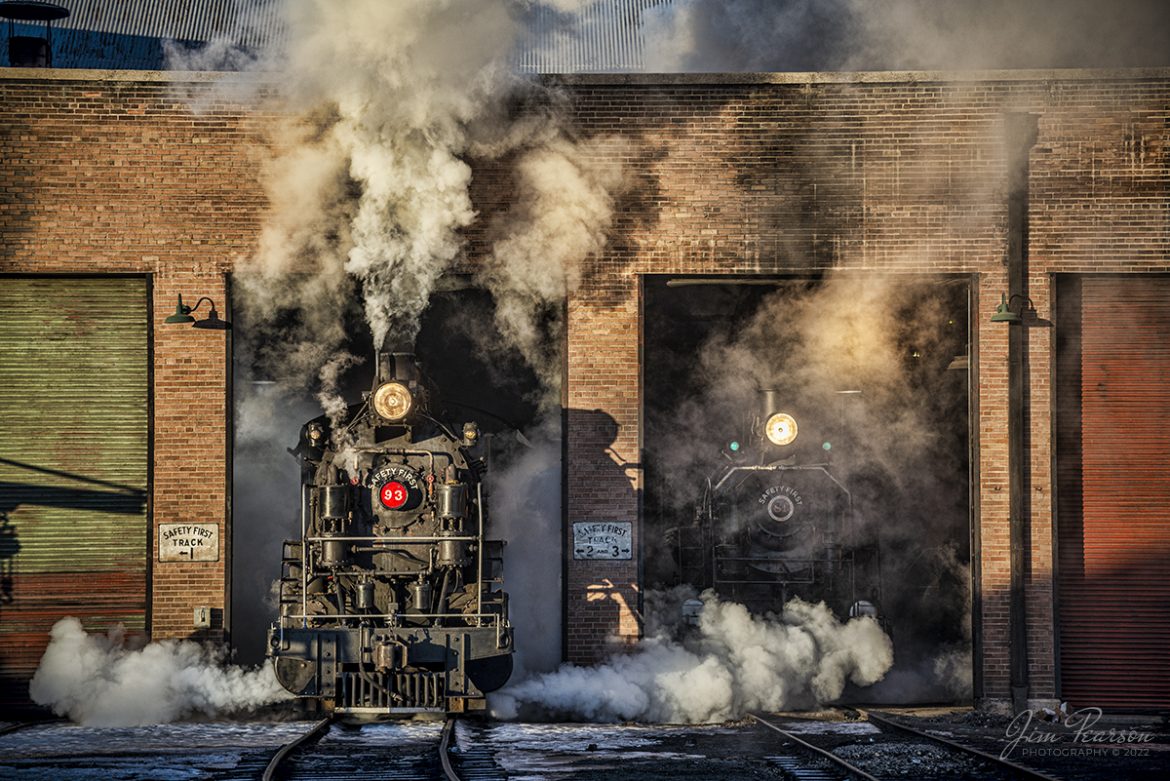 Early morning golden light rakes across the engine house as Nevada Northern Railway steam locomotive #93 pulls out into the frigid air at Ely, Nevada on track 2, as #81 waits its turn on track three, during the museums 2022 Winter Photo Charter event on February 12th, 2022.


According to Wikipedia: The Nevada Northern Railway Museum is a railroad museum and heritage railroad located in Ely, Nevada and operated by a historic foundation dedicated to the preservation of the Nevada Northern Railway.


The museum is situated at the East Ely Yards, which are part of the Nevada Northern Railway. The site is listed on the United States National Register of Historic Places as the Nevada Northern Railway East Ely Yards and Shops and is also known as the "Nevada Northern Railway Complex". The rail yards were designated a National Historic Landmark District on September 27, 2006. The site was cited as one of the best-preserved early 20th-century railroad yards in the nation, and a key component in the growth of the region's copper mining industry. Developed in the first decade of the 20th century, it served passengers and freight until 1983, when the Kennecott Copper Company, its then-owner, donated the yard to a local non-profit for preservation. The property came complete with all the company records of the Nevada Northern from its inception.


According to the NNRY website, #93 is a 2-8-0 that was built by the American Locomotive Company in January of 1909 at a cost of $17,610. It was the last steam locomotive to retire from original revenue service on the Nevada Northern Railway in 1961 and was restored back into service in 1993. 


Locomotive #81 is a "Consolidation" type (2-8-0) steam locomotive that was built for the Nevada Northern in 1917 by the Baldwin Locomotive Works in Philadelphia, PA, at a cost of $23,700. It was built for Mixed service to haul both freight and passenger trains on the Nevada Northern railway.



Tech Info: Nikon D800, RAW, Nikon 70-300 @ 116mm, f/4.8, 1/400, ISO 100, Exp. Comp.: -1.0.


#trainphotography #railroadphotography #trains #railways #jimpearsonphotography #trainphotographer #railroadphotographer #steamtrains #nevadanorthernrailway