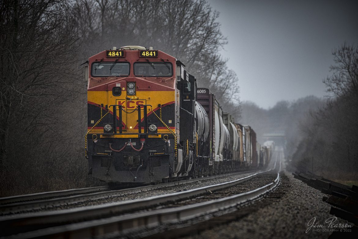 March 19, 2022 - The crew on eastbound CSX Q374 (Rose Lake, IL (UP) - Avon, IN) freight waits for a signal on the Indianapolis Terminal Subdivision so it can head east from Danville, IN, with Kansas City Southern 4841 and Norfolk Southern 4237 leading the way.

According to worldwiderails.com: Those who are unfamiliar with railroads may not understand why railroads would share locomotives, but there are many good reasons for this long-standing practice. It might seem contradictory for railroads to share locomotives since theyre sometimes in direct competition with each other, but this practice benefits both companies. 

Railroads share locomotives in a series of arrangements known as pooled power arrangements. Railroads will share both tracks and locomotives with other railroads to pool resources for increased efficiency.

When a locomotive operates through the territories of multiple railroads without stopping, this locomotive is said to be running on run-through power. In most cases, it is more efficient to leave the locomotive on the track to carry freight for either line than it is to try and pull the locomotive once it hits a territory edge. Trains operate most efficiently when they can remain running.

Tech Info: Nikon D800, RAW, Sigma 150-600 @ 500mm, f/6, 1/400, ISO 450.

#trainphotography #railroadphotography #trains #railways #jimpearsonphotography #trainphotographer #railroadphotographer