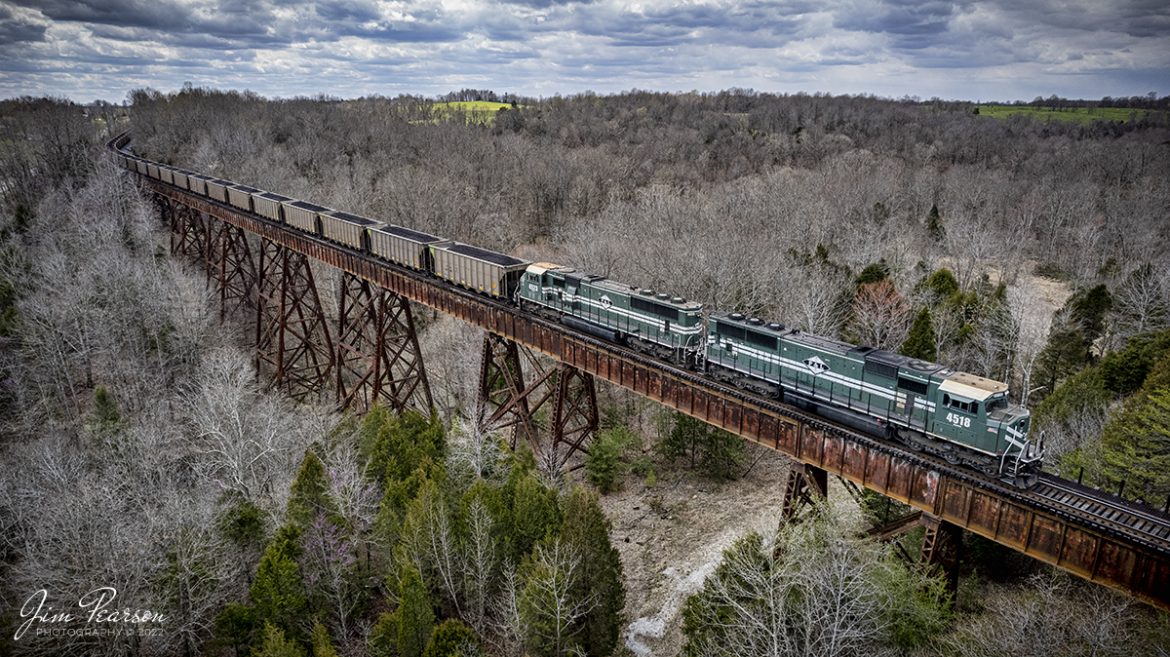 Paducah and Louisville Railway 4518 & 4523 lead a loaded Louisville Gas and Electric coal train, as it crosses over the 148 high and 891 ft. long, Big Clifty bridge, at Big Clifty, Kentucky on its way north to Louisville, KY on April 7th, 2022.

Tech Info: DJI Mavic Air 2S Drone, RAW, 22mm, f/2.8, 1/1000, ISO 130

#trainphotography #railroadphotography #trains #railways #dronephotography #trainphotographer #railroadphotographer #jimpearsonphotography