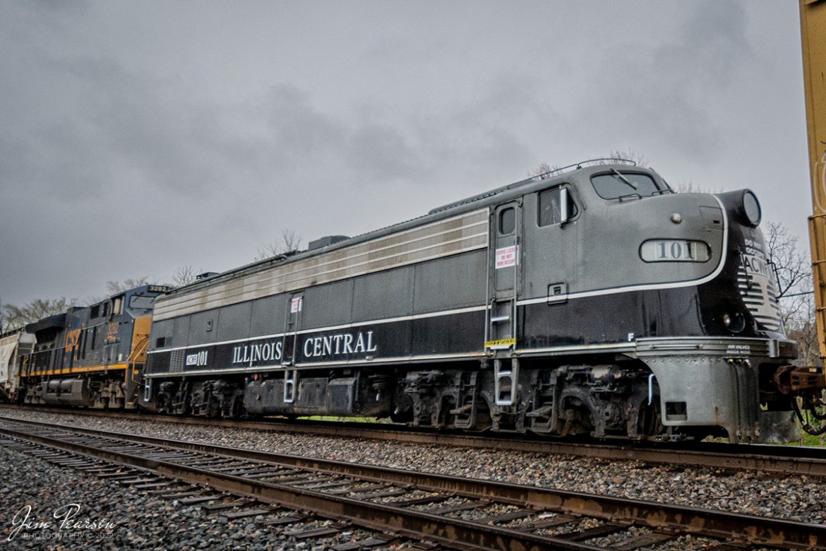 On April 8th, 2022, CSX Q513 heads south through downtown Hanson, Kentucky on the CSX Henderson Subdivision as ex-Illinois Central Executive E8 Unit 101 runs dead in tow behind the mid train DPU 3282. The E unit was purchased by Aberdeen, Carolina & Western Railway Company (ACWR) and on its way to be delivered at Aberdeen, NC.

Tech Info: Nikon D800, RAW, Nikon 10-24 @ 10mm, f/3.5, 1/5000, ISO 640.

#trainphotography #railroadphotography #trains #railways #jimpearsonphotography #trainphotographer #railroadphotographer