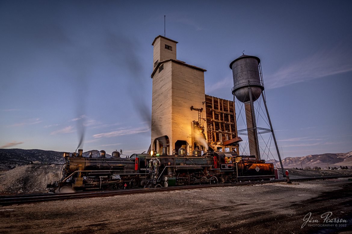 Nevada Northern Railway steam locomotives 93 and 81 pose next to the coaling tower and water tank at dusk during the museums Winter Photo Charter at Ely, Nevada, on February 11th, 2022.

Locomotive #93 is a 2-8-0 that was built by the American Locomotive Company in January of 1909 at a cost of $17,610. It was the last steam locomotive to retire from original revenue service on the Nevada Northern Railway in 1961 and was restored to service in 1993.

The Nevada Northern No. 81 is a "Consolidation" type (2-8-0) steam locomotive it was built for the Nevada Northern in 1917 by the Baldwin Locomotive Works in Philadelphia, PA, at a cost of $23,700. It was built for Mixed service to haul both freight and passenger trains on the Nevada Northern railway.

According to Wikipedia: The Nevada Northern Railway Museum is a railroad museum and heritage railroad located in Ely, Nevada and operated by a historic foundation dedicated to the preservation of the Nevada Northern Railway.

Tech Info: Nikon D800, RAW, Nikon 10-24mm @ 13mm, f/4, 2.5 seconds, ISO 100.

#trainphotography #railroadphotography #trains #railways #jimpearsonphotography #trainphotographer #railroadphotographer