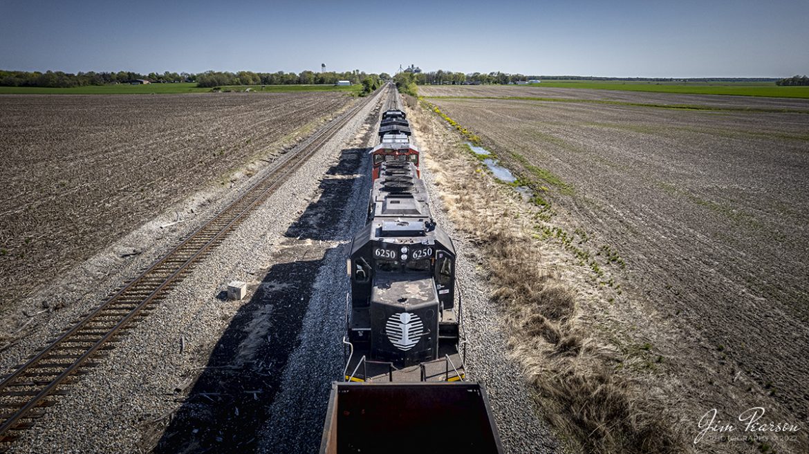 Illinois Central Death Star locomotive 6250 sits dead in tow as the third unit, behind a CN and Norfolk southern unit, as they work on dropping off and picking up cars at the CN yard at Centralia, Illinois on CN A432 on April 27th, 2022.

Tech Info: DJI Mavic Air 2S Drone, RAW, 22mm, f/2.8, 1/2500, ISO 200.

#trainphotography #railroadphotography #trains #railways #dronephotography #trainphotographer #railroadphotographer #jimpearsonphotography