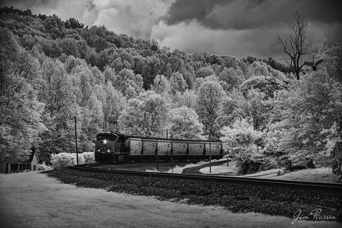 May 6th, 2022 - Drama, that's one of the major things I like about the look of black and white Infrared photography of trains! It produces a great look for that I love, as this shot of empty CSX grain express train, G304 as it rounds the curve coming into downtown Mortons Gap, Kentucky shows as it heads north on the Henderson Subdivision.

Tech Info: Fuji XT-1, RAW, Converted to 720nm B&W IR, Nikon 18-250 @ 92mm, f/5, 1/160, ISO 200.