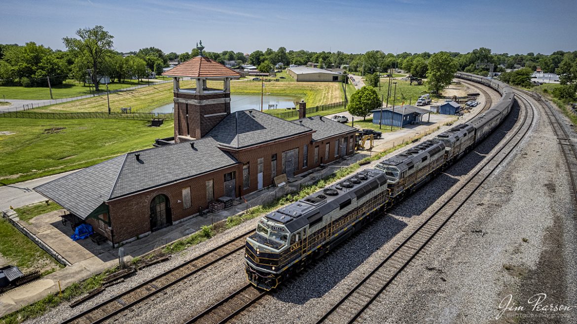 May 12, 2022 - CSX P001-09 Presidential Office Car passenger train passes the old Louisville and Nashville Passenger depot at Henderson, Kentucky as CSXT 1, 2 and 3 leads the way.

CSX Transportation has repainted 3 of its executive fleet F40PH locomotives in a paint scheme inspired by predecessor Baltimore & Ohio and a fleet of cars to finish out the train set. The city of Baltimore chartered the railroad on Feb. 28, 1827, to build west to a suitable point on the Ohio River. Ground was broken on July 4, 1828, at Carrollton, Md. By 1929 the railroad operated 5,658 miles of track and had 2,364 locomotives. In the 1970s the B&O became part of Chessie System and in the 1980s it became part of CSX.
According to the abandonedonline.net website: This depot, built of brick and granite, was constructed by the local firm Bailey & Koerner opened at the cost of $25,000 on July 1, 1902. The Union Station replaced the separate stations for the L&N and the IC. The former L&N depot was converted into the residence for the local yard foreman while the former IC station was used until it was demolished in November 1942.

By 1922, Union Station was handling 24 passenger trains daily, but the advent of the automobile and the construction of the interstate highway system and parkways in the region decimated passenger trains. The IC ceased passenger operations on February 13, 1941, and the station was closed by the L&N after it ceased passenger trains in 1971.

The depot is currently owned by Railmark Foundation and is under restoration. I've not found out what it's intended use will be.

Tech Info: DJI Mavic Air 2S Drone, Altitude 55ft, RAW, 22mm, f/2.8, 1/2500, ISO 140.

#trainphotography #railroadphotography #trains #railways #dronephotography #trainphotographer #railroadphotographer #jimpearsonphotography