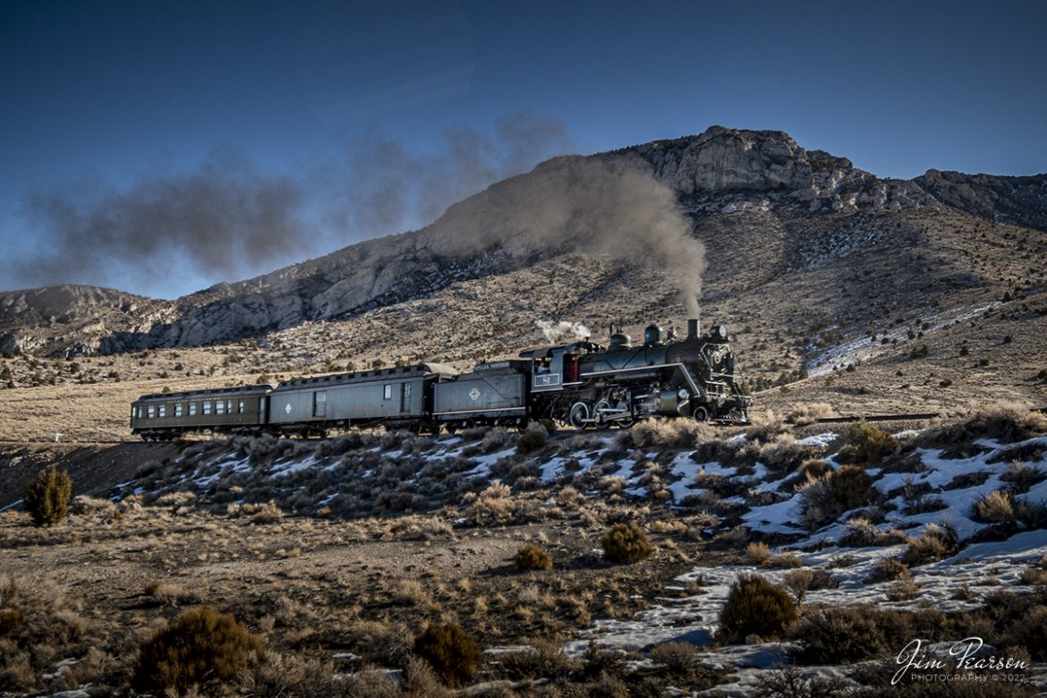 Nevada Northern Railway steam locomotive #81 pulls a passenger train through Steptoe Valley as it heads toward Ely, Nevada during the museums Winter Photo Charter event with engineer Dale Olson at the controls on the morning of February 13th, 2022.

According to Wikipedia: The Nevada Northern Railway Museum is a railroad museum and heritage railroad located in Ely, Nevada and operated by a historic foundation dedicated to the preservation of the Nevada Northern Railway.

The museum is situated at the East Ely Yards, which are part of the Nevada Northern Railway. The site is listed on the United States National Register of Historic Places as the Nevada Northern Railway East Ely Yards and Shops and is also known as the "Nevada Northern Railway Complex". The rail yards were designated a National Historic Landmark District on September 27, 2006. The site was cited as one of the best-preserved early 20th-century railroad yards in the nation, and a key component in the growth of the region's copper mining industry. Developed in the first decade of the 20th century, it served passengers and freight until 1983, when the Kennecott Copper Company, its then-owner, donated the yard to a local non-profit for preservation. The property came complete with all the company records of the Nevada Northern from its inception.

Engine #81 is a "Consolidation" type (2-8-0) steam locomotive that was built for the Nevada Northern in 1917 by the Baldwin Locomotive Works in Philadelphia, PA, at a cost of $23,700. It was built for Mixed service to haul both freight and passenger trains on the Nevada Northern railway.

Tech Info: Nikon D800, RAW, Nikon 10-24 @ 10mm, f/3.5, 1/2000, ISO 125.

#trainphotography #railroadphotography #trains #railways #jimpearsonphotography #trainphotographer #railroadphotographer #steamtrains #nevadanorthernrailway