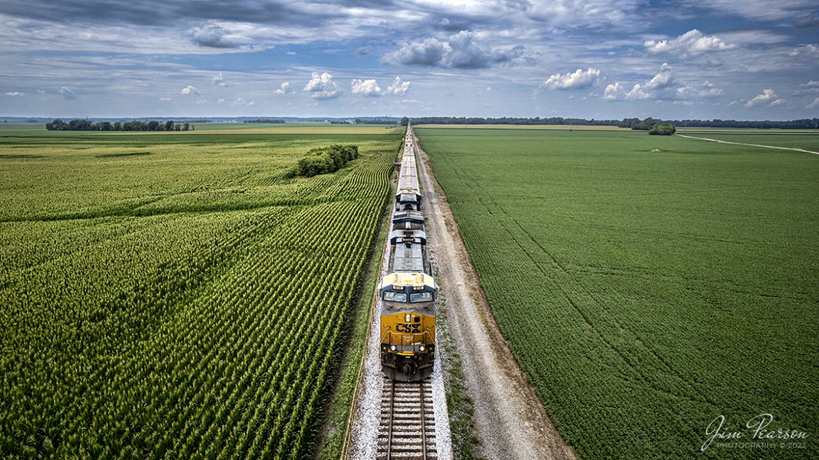 CSX 914 travels through the expansive flood plain with the fields full of corn and soybeans, as CSX loaded grain train heads south out of Evansville, Indiana on the Henderson Subdivision on July 14th, 2022. Here they are staring the climb up the viaduct over the Ohio River to Henderson, Kentucky, and points south. During the rainy season much of this area as far as the eye can see is prone to floodwaters from the Ohio River.


This is a favorite area for me and many other railfans to chase and photograph trains because of the uniqueness of the long viaduct which is right at 4.5 miles long.


The viaduct and bridge over the river were built by the L&N railroad and were dedicated on the last day of 1932 at a cost about $4 million. It replaced one that was erected in 1885, also built by the L&N, and at that time was the longest channel span of that type in the world at 2.3 miles long.


Tech Info: DJI Mavic Air 2S Drone, RAW, 22mm, f/2.8, 1/1600, ISO 100.


#trainphotography #railroadphotography #trains #railways #dronephotography #trainphotographer #railroadphotographer #jimpearsonphotography