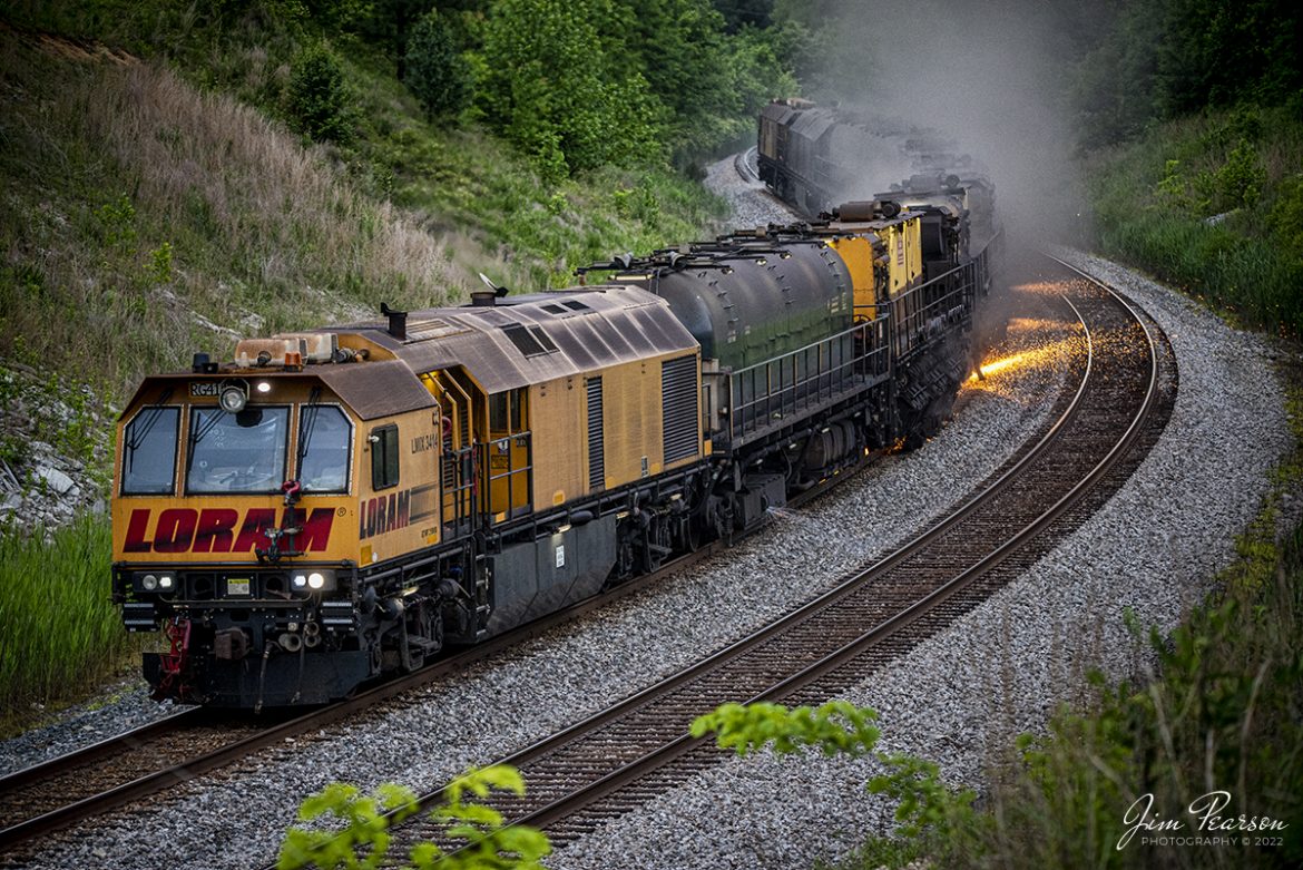 LORAM Railgrinder RG414 grinds through the S curve at Nortonville, Kentucky as it makes its way south  on the CSX Henderson Subdivision on May 23rd, 2022.

According to LORAM's Website: Rail grinding is the cornerstone of virtually every railroad maintenance program. It maximizes the life and value of rail assets through precision removal of fatigued metal, restoration of the rail head profile and removal of rail defects which are the optimization goals of an effective rail grinding program.

Tech Info: Nikon D800, RAW, Sigma 150-600 @ 150mm, f/5, 1/320, ISO 3200.

#trainphotography #railroadphotography #trains #railways #jimpearsonphotography #trainphotographer #railroadphotographer #loramrailgrinder