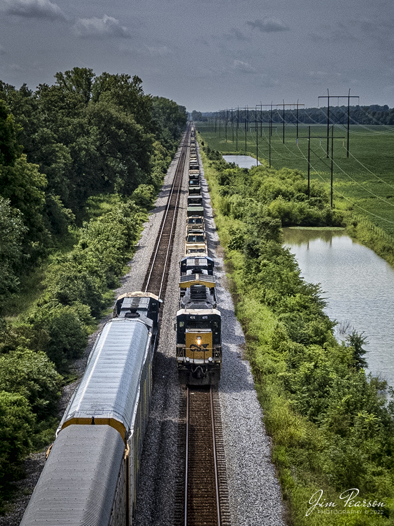 CSX loaded military train S850 sits in the siding at the north end of Rankin, Kentucky as they meet a southbound I025 on the Henderson Subdivision on August 4th, 2022. I'm told that lately this intermodal has been running with these autoracks loaded with Teslas on their way south. Today's train had 25 autoracks. The cars range in price from $46,000 - $120,000, depending on the model.

Military Humvees cost around $70,000 each. Upgraded humvee variants, called armored or up-armored Humvees, carry higher price tags that range from $160,000 to $220000. A lot of money being moved here, not even including the intermodal shipments!

Tech Info: DJI Mavic Air 2S Drone, RAW, 22mm, f/2.8, 1/3000, ISO 100.

#trainphotography #railroadphotography #trains #railways #dronephotography #trainphotographer #railroadphotographer #jimpearsonphotography