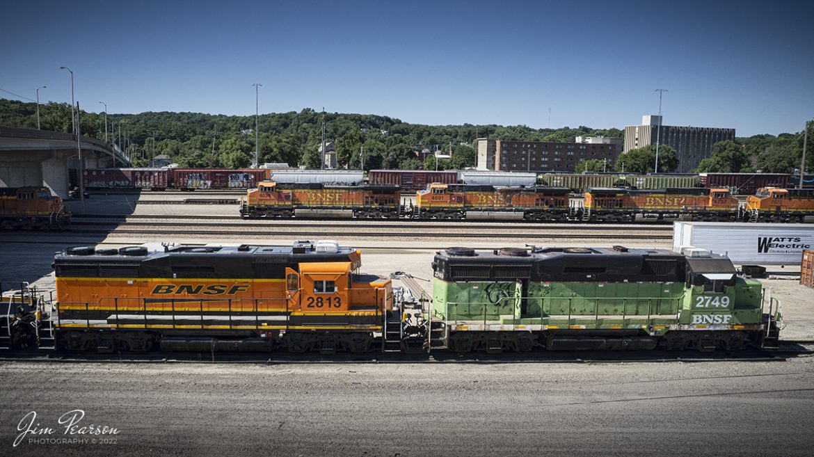 Still in green and black paint, BNSF 2749 heads up a string of power as it sits at BNSF Argentine Yard at Kansas City, Kansas, on June 30th, 2022 while waiting for its next assignment.

According to Wikipedia: The Argentine Yard is a BNSF Railway marshalling yard in Kansas City, Kansas. With 60 tracks and an area of about 2miles, it is the largest marshalling yard in the BNSF network. It lies between the Kansas River to the north and the eponymous Argentine borough of Kansas City, Kansas, to the south, about six miles west of downtown Kansas City, Missouri.

Argentine Yard is one of several major rail yards in the Kansas City metropolitan area operated by the Union Pacific, Norfolk Southern, and Kansas City Southern, in addition to BNSF. The Kansas City metropolitan area is the largest railroad hub in the United States in terms of freight volume; more than 300 freight trains reach or leave the metropolitan region every day (2016).
The tracks through the junction have been reduced or changed around over the years, but the area remains one of KC's Busiest locations.

Tech Info: DJI Mavic Air 2S Drone, RAW, 22mm, f/2.8, 1/2000, ISO 110.