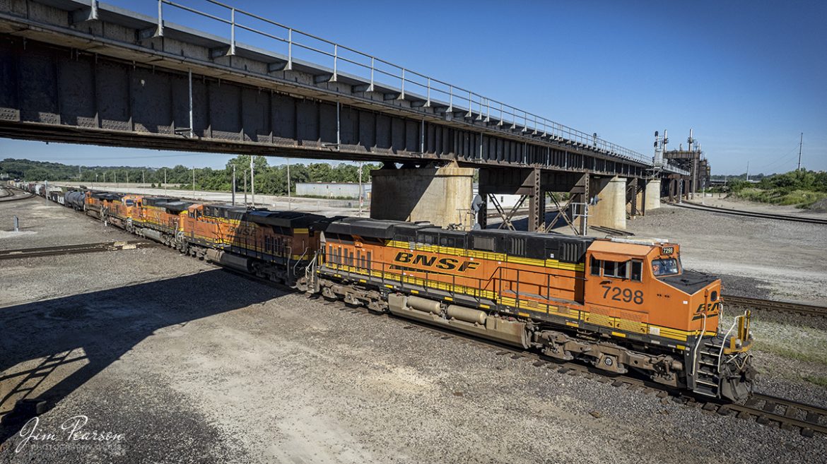 BNSF 7298 heads up 5 units with a manifest train as they pass over the diamonds at Santa Fe Junction on June 30th, 2022.

Santa Fe Junction sees on average over 100 trains a day and it hosts the double decked railroad (ATSF Double Deck Railroad) bridge that crosses the Kansas River into Missouri, a triple crossing. The junction is partly in Missouri and Kansas and sees BNSF, UP, KCT, Amtrak, KCS, NS and CP traffic, from what I saw during my visit.

The tracks through the junction have been reduced or changed around over the years, but the area remains one of KCs Busiest locations.

Tech Info: DJI Mavic Air 2S Drone, RAW, 22mm, f/2.8, 1/1600, ISO 120.

#trainphotography #railroadphotography #trains #railways #dronephotography #trainphotographer #railroadphotographer #jimpearsonphotography