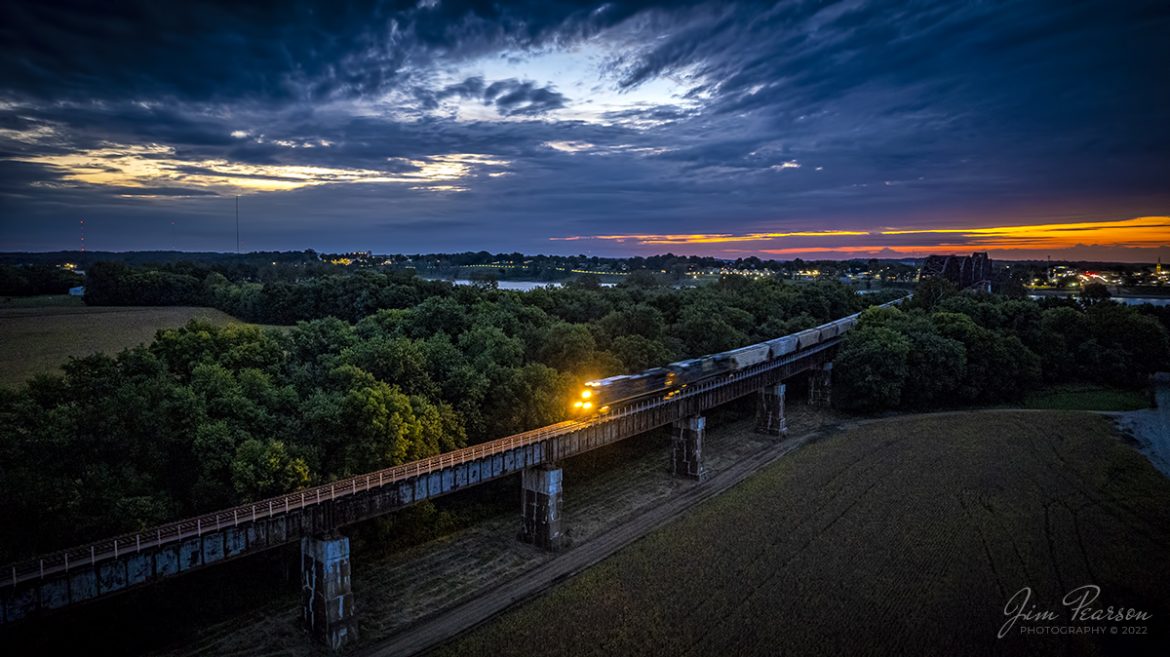 CSX B207, a combined Phosphate and Ethanol train, heads north over the Ohio River from Henderson, KY at dawn as it slowly makes its way north on the CSX Henderson Subdivision with its train on September 22, 2022, the first day of autumn! 

Tech Info: DJI Mavic Air 2S Drone, 22mm, f/2.8, 1/8th second, ISO 690.

#trainphotography #railroadphotography #trains #railways #dronephotography #trainphotographer #railroadphotographer #jimpearsonphotography