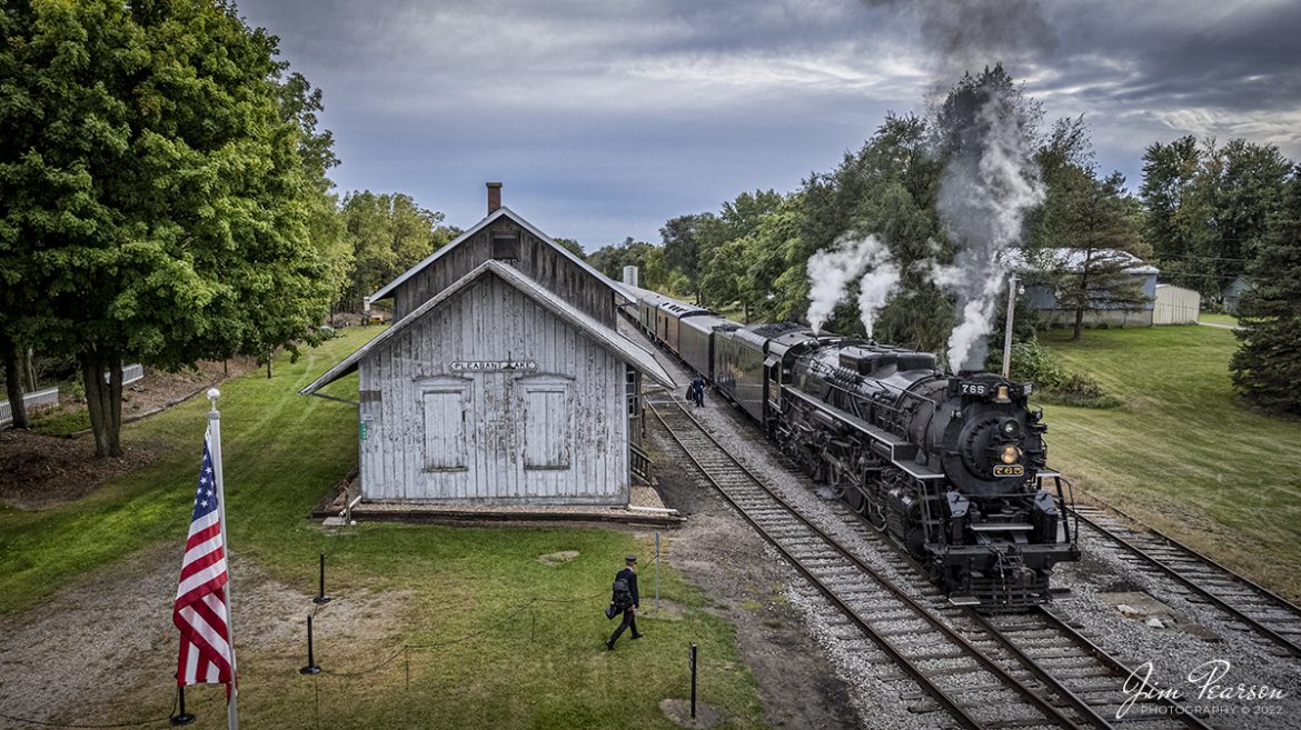 The conductor of the American History Train, being led by Nickel Plate Road (NKP) steam locomotive 765, heads to his train on September 24th, 2022, at Pleasant Lake, Indiana.

NKP 765 was pulling the American History Train between Pleasant Lake from Angola, Indiana during the annual American History Days Festival. It took guests back to the 1940s for a living history experience. The passengers then got a 45-minute layover at Pleasant Lake where they visited with WWII reenactors, listened to live music and much more.

According to Wikipedia: Pleasant Lake depot is also known as the New York Central Railroad Depot and is a historic train station located at Pleasant Lake, Steuben Township, Steuben County, Indiana. It was built in 1882 by the Lake Shore and Michigan Southern Railway, and is a one-story, rectangular, Gothic Revival style frame building. It has a gable roof and is clad in board and batten siding.

It was listed on the National Register of Historic Places in 2001 as the Pleasant Lake Depot.

Nickel Plate Road 765 is a class "S-2" 2-8-4 "Berkshire" type steam locomotive built for the New York, Chicago & St. Louis Railroad, commonly referred to as the "Nickel Plate Road".

No. 765 continues to operate in mainline excursion service and is owned and maintained by the Fort Wayne Railroad Historical Society and was also added to the National Register of Historic Places on September 12, 1996.

Tech Info: DJI Mavic Air 2S Drone, 22mm, f/2.8, 1/1000, ISO 100.

#trainphotography #railroadphotography #trains #railways #dronephotography #trainphotographer #railroadphotographer #jimpearsonphotography