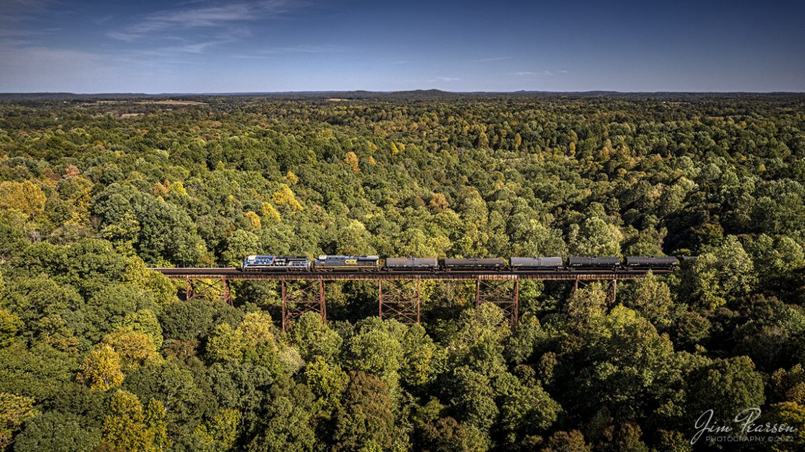CSX Honoring our Law Enforcement locomotive 3194 leads M648 north across Gum Lick Trestle, between Kelly and Crofton, Kentucky, as the first signs of fall begin to show in the trees as it heads north on the Henderson Subdivision on September 26th, 2022. Gum Lick is the highest trestle on the Henderson Subdivision, which runs between Nashville, TN and Evansville, IN.

Tech Info: DJI Mavic Air 2S Drone, RAW, 22mm, f/2.8, 1/1600, ISO 110.

#trainphotography #railroadphotography #trains #railways #dronephotography #trainphotographer #railroadphotographer #jimpearsonphotography