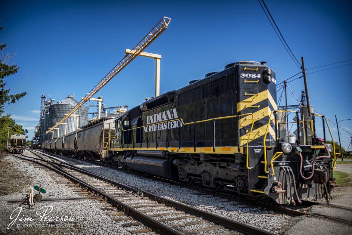 Indiana Northeastern Railroad 3084, along with another train work on picking up grain at Reading, Michigan on September 23rd, 2022.

According to Wikipedia: The Indiana Northeastern Railroad (reporting mark IN) is a Class III short line freight railroad operating on nearly 130 miles (210 km) in southern lower Michigan, northeast Indiana, and northwest Ohio. 

The Indiana Northeastern Railroad Company began operations in December 1992 and is an independent privately owned company. As of 2017 the railroad hauled more than 7,000 carloads per year. Commodities moved by the railroad include corn, soybeans, wheat, and flour. It also handles plastics, fiberboard, aluminum, copper, coal, perlite, stone, lumber, glass, rendering products, as well as agricultural fertilizers and chemicals. 

In the early 1990s the Hillsdale County Railway was heavily in debt. Its trackage was suffering from deferred maintenance and derailments were becoming a common occurrence. Then in 1992, a 50-car eastbound unit train from South Milford hauled by HCRC derailed near Hamilton, Indiana costing the South Milford Grain Company $30,000. The grain elevator company's owners decided to assume HCRC's $1 million in debt, and it acquired the railway. The grain company then created the Indiana Northeastern Railroad Company to take over the rail operations of the HCRC and its Pigeon River Railroad on December 22, 1992. It’s now owned by the grain company and farmers in the areas it serves, and major track improvements and upgrades have been done over the years creating a solid and reliable railroad.

Tech Info: Nikon D800, RAW, Sigma 24-70mm @ 70mm, f/2.8, 1/1600, ISO 220.

#trainphotography #railroadphotography #trains #railways #jimpearsonphotography #trainphotographer #railroadphotographer #shortlinerailroad #indiananortheasternrailroad