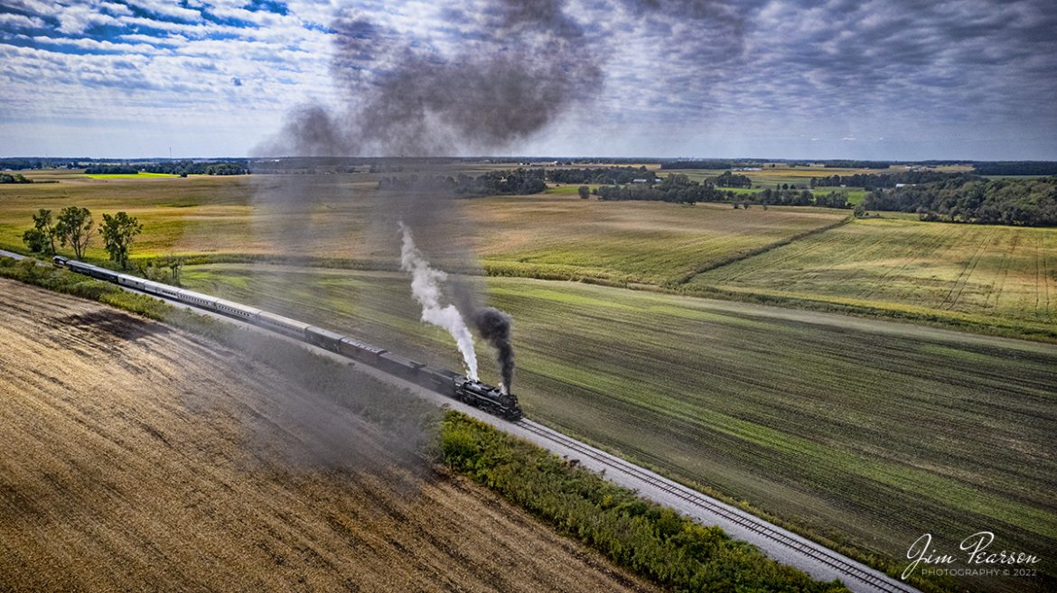 Nickel Plate Road (NKP) 765 leads the American History Train as they begin to run through the town of Pleasant Lake, Indiana along the Indiana Northeastern Railroad, as they head back to Angola, Indiana to pickup another load of passengers on September 24th, 2022.

NKP 765 was pulling the American History Train between Pleasant Lake from Angola, Indiana during the annual American History Days Festival. It took guests back to the 1940s for a living history experience. The passengers then got a 45-minute layover at Pleasant Lake where they visited with WWII reenactors, listened to live music and much more.

According to Wikipedia: Nickel Plate Road 765 is a class "S-2" 2-8-4 "Berkshire" type steam locomotive built for the New York, Chicago & St. Louis Railroad, commonly referred to as the "Nickel Plate Road".

No. 765 continues to operate in mainline excursion service and is owned and maintained by the Fort Wayne Railroad Historical Society and was also added to the National Register of Historic Places on September 12, 1996.

Tech Info: DJI Mavic Air 2S Drone, 22mm, f/2.8, 1/3000, ISO 200.

#trainphotography #railroadphotography #trains #railways #dronephotography #trainphotographer #railroadphotographer #jimpearsonphotography #nkp765 #steamtrain