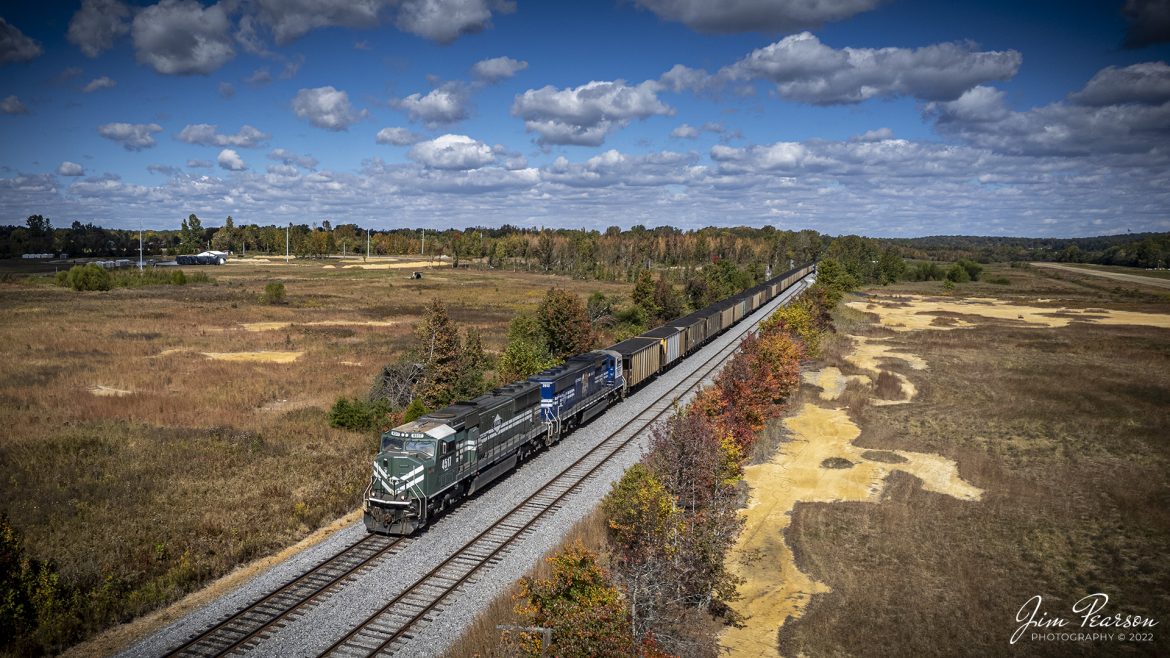 Evansville Western Railway (EVWR) 4517 and Paducah and Louisville Railway (PAL) University of Kentucky locomotive 2012 lead a loaded coal train past the siding at Dawson Springs, Kentucky on October 8th, 2022, as they head south on the PAL on a beautiful fall morning.

The Paducah & Louisville Railway (reporting mark PAL) is a Class II railroad that operates freight service between Paducah and Louisville, Kentucky. The line is located entirely within the Commonwealth of Kentucky. The parent company of the PAL, P&L Transportation, also operates the Evansville Western Railway and the Appalachian and Ohio Railroad.

Tech Info: DJI Mavic Air 2S Drone, RAW, 22mm, f/2.8, 1/2000, ISO 110.

#trainphotography #railroadphotography #trains #railways #dronephotography #trainphotographer #railroadphotographer #jimpearsonphotography