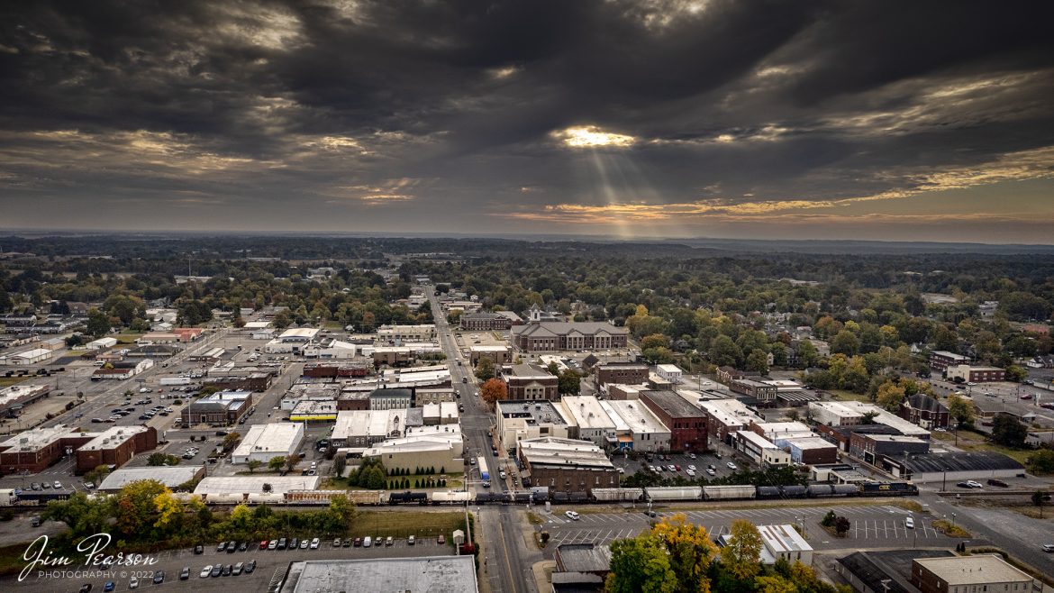 Sunlight steams down from the early morning stormy skies as CSX M513 makes its way through downtown Madisonville, Kentucky southbound on the Henderson Subdivision on October 12th, 2022, with fall color beginning to dot the landscape.

Tech Info: DJI Mavic Air 2 Drone, RAW, 4.5mm (24mm equivalent lens) f/2.8, 1/1500, ISO 110.

#trainphotography #railroadphotography #trains #railways #dronephotography #trainphotographer #railroadphotographer #jimpearsonphotography