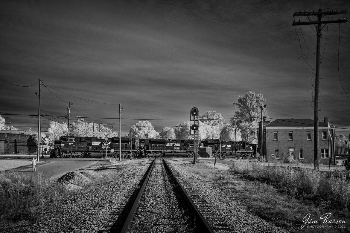 Todays Infrared photo is of Norfolk Southern Railway 1107, as it leads 895 a trio of locomotives as they cross over the Indiana Southern Railway at the diamond in downtown Oakland City, Indiana. They are pulling an empty coal train westbound on the Norfolk Southern east/west District on October 20th, 2022.

Tech Info: Fuji XT-1, RAW, Converted to 720nm B&W IR, Nikon 10-24 @ 24mm, f/4.5, 1/500, ISO 320.

#trainphotography #railroadphotography #trains #railways #jimpearsonphotography #infraredtrainphotography #infraredphotography #trainphotographer #railroadphotographer