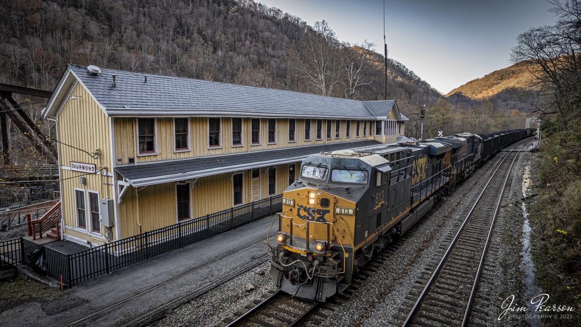 CSXT 813 pulls past the old C&O Depot at Thurmond, West Virginia as it heads east with loaded coal train C206 on the New River Subdivision on November 3rd, 2022.

According to Wikipedia: Thurmond is a town in Fayette County, West Virginia, United States, on the New River. The population was five at the 2020 census. During the heyday of coal mining in the New River Gorge, Thurmond was a prosperous town with several businesses and facilities for the Chesapeake and Ohio Railway.

The C&O passenger railway depot in town was renovated in 1995 and Amtrak stops there 3 times a week. The entire town is a designated historic district on the National Register of Historic Places. 

Most of Thurmond is owned by the National Park Service for the New River Gorge National Park and Preserve.

Thurmond is the least-populous municipality in West Virginia. During the June 14, 2005, city elections six of the city's seven residents sought elected office.

Tech Info: DJI Mavic Air 2S Drone, 22mm, f/2.8, 1/1250, ISO 130.

#trainphotography #railroadphotography #trains #railways #dronephotography #trainphotographer #railroadphotographer #jimpearsonphotography