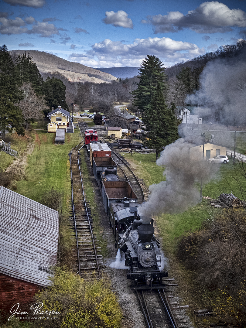 Meadow River Lumber Company steam locomotive, Heisler No. 6, backs into the station at Durban, West Virginia on November 4th, 2022, during the Mountain Rail WV, Rail Heritage Photography Weekend. The event was held at the Durbin & Greenbrier Valley Railroad, Durbin, WV, and Cass Scenic Railroad, Cass, WV, from November 4-6th, 2022. Heisler No. 6 was built in 1929 and is a Class C-90 locomotive with 3 trucks.

According to Wikipedia: The Durbin and Greenbrier Valley Railroad (reporting mark DGVR) is a heritage and freight railroad in the U.S. states of Virginia and West Virginia. It operates the West Virginia State Rail Authority-owned Durbin Railroad and West Virginia Central Railroad (reporting mark WVC), as well as the Shenandoah Valley Railroad in Virginia.

Tech Info: DJI Mavic Air 2S Drone, 22mm, f/2.8, 1/1000, ISO 110.

#trainphotography #railroadphotography #trains #railways #dronephotography #trainphotographer #railroadphotographer #jimpearsonphotography #trainsfromtheair