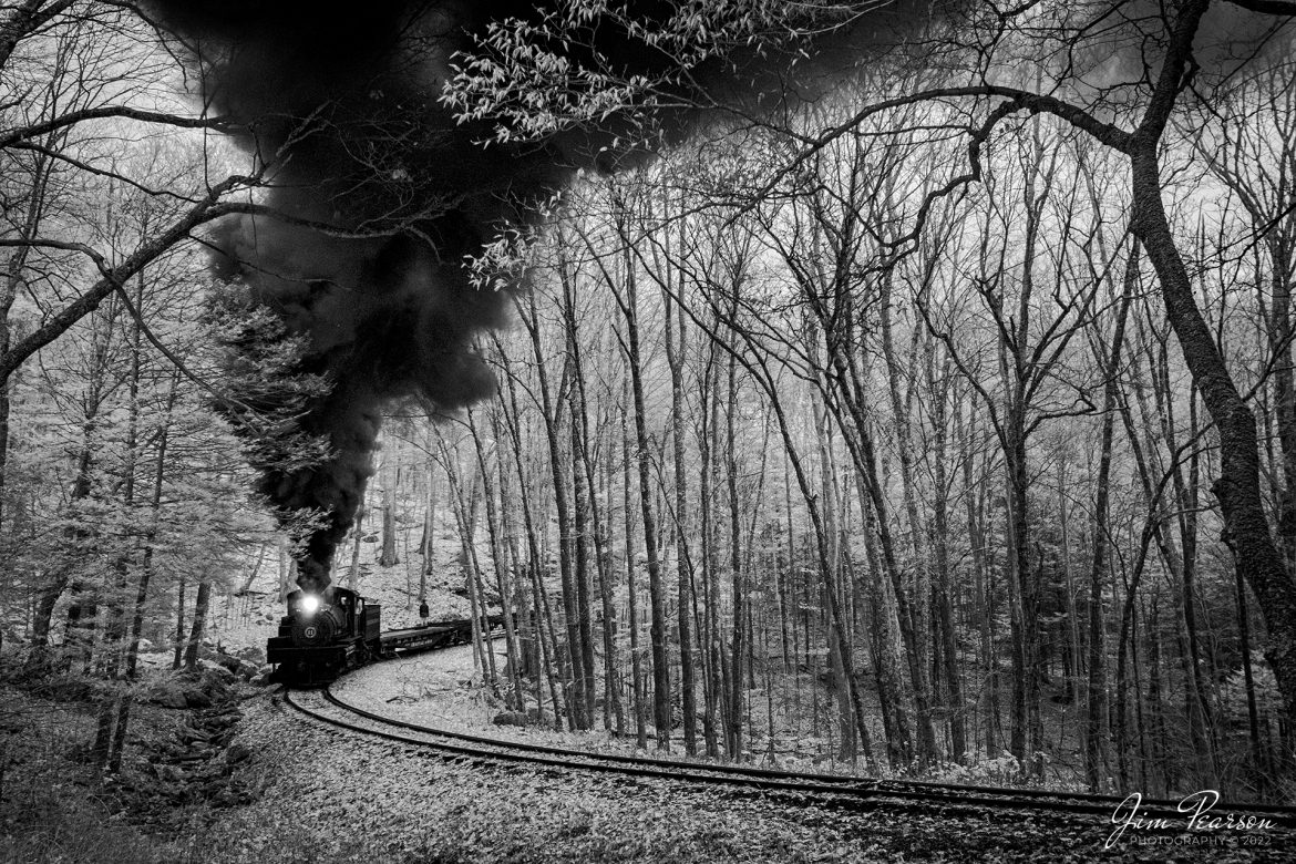 This week’s Saturday Infrared photo is of Cass Scenic Railway Shay locomotive number 11, (C-90-3) as it backs through the forest during the Rail Heritage Photography Weekend photo shoot at Cass, West Virginia on November 5th, 2022. 

According to Wikipedia: Cass Scenic Railroad, is an 11-mile (18 km) long heritage railway owned by the West Virginia State Rail Authority and operated by the Durbin and Greenbrier Valley Railroad. The park also includes the former company town of Cass and a portion of the summit of Bald Knob, the highest point on Back Allegheny Mountain.

Founded in 1901 by the West Virginia Pulp and Paper Company (now WestRock), Cass was built as a company town to serve the needs of the men who worked in the nearby mountains cutting spruce and hemlock for the West Virginia Spruce Lumber Company, a subsidiary of WVP&P. At one time, the sawmill at Cass was the largest double-band sawmill in the world. It processed an estimated 1.25 billion board feet (104,000,000 cu ft; 2,950,000 m3) of lumber during its lifetime. In 1901 work started on the 4 ft 8+1⁄2 in (1,435 mm) standard gauge railroad, which climbs Back Allegheny Mountain. 

The railroad eventually reached a meadow area, now known as Whittaker Station, where a logging camp was established for the immigrants who were building the railroad. The railroad soon reached the top of Gobblers Knob, and then a location on top of the mountain known as 'Spruce'. The railroad built a small town at that location, complete with a company store, houses, a hotel, and a doctor's office. Work soon commenced on logging the red spruce trees, which grew in the higher elevations.

Tech Info: Fuji XT-1, RAW, Converted to 720nm B&W IR, Nikon 10-24 @ 24mm, f/4.5, 1/180, ISO 2000.

#trainphotography #railroadphotography #trains #railways #jimpearsonphotography #infraredtrainphotography #infraredphotography #trainphotographer #railroadphotographer#cassscenicrailway #steamtrains