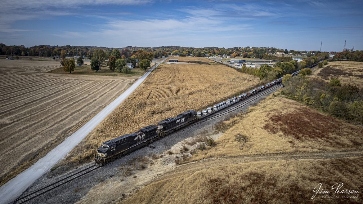 Norfolk Southern 4152 leads D375 as they depart Huntingburg, Indiana as it heads south on the NS Evansville Branch with a load of rolled steel for the AK Steel plant at Rockport, Indiana, on October 20th, 2022, on a beautiful fall afternoon.

Tech Info: DJI Mavic Air 2S Drone, 22mm, f/2.8, 1/2000, ISO 120.

#trainphotography #railroadphotography #trains #railways #dronephotography #trainphotographer #railroadphotographer #jimpearsonphotography